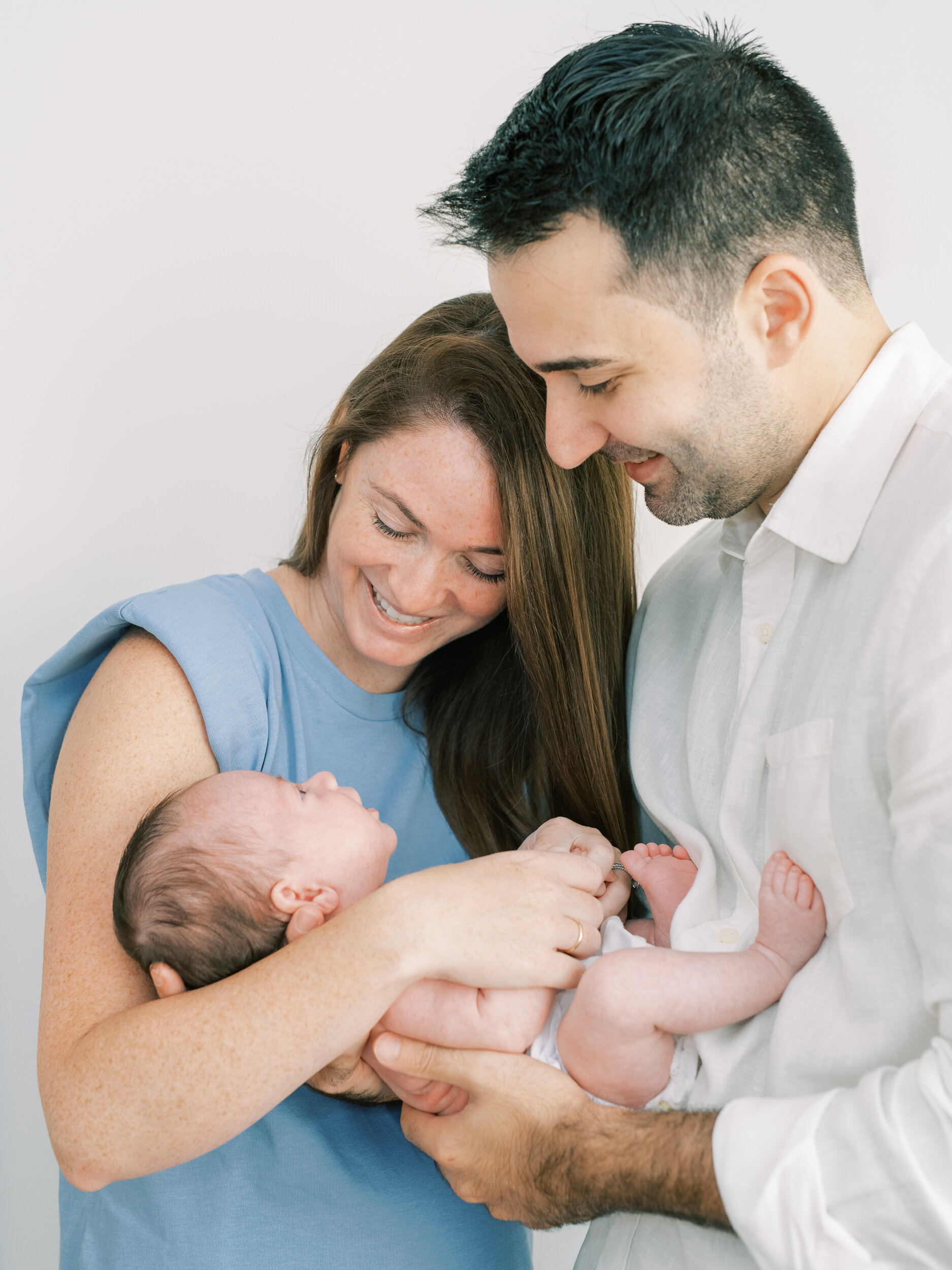 Mother Holding Newborn son with Father, Newborn Photography in NYC