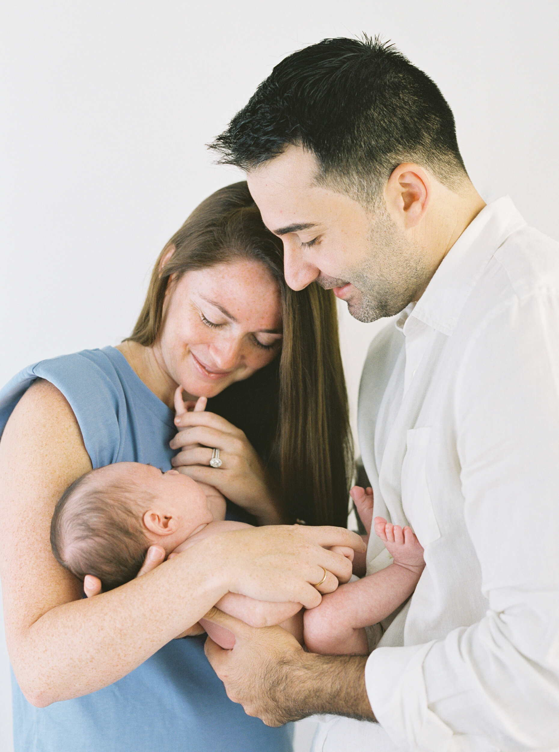 Mother Holding Newborn son with Father, Newborn Photography in NYC