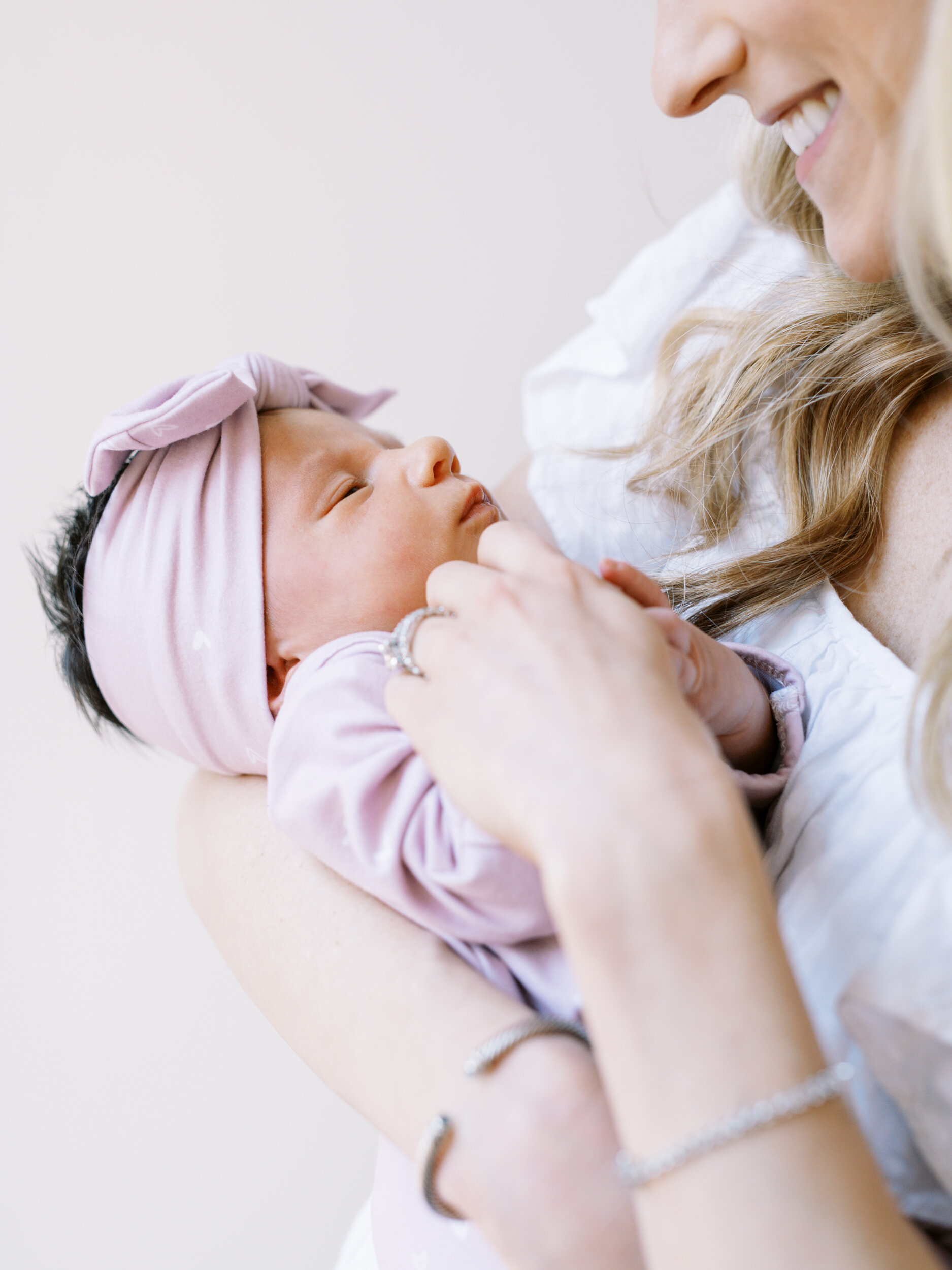 Mother holds newborn daughter