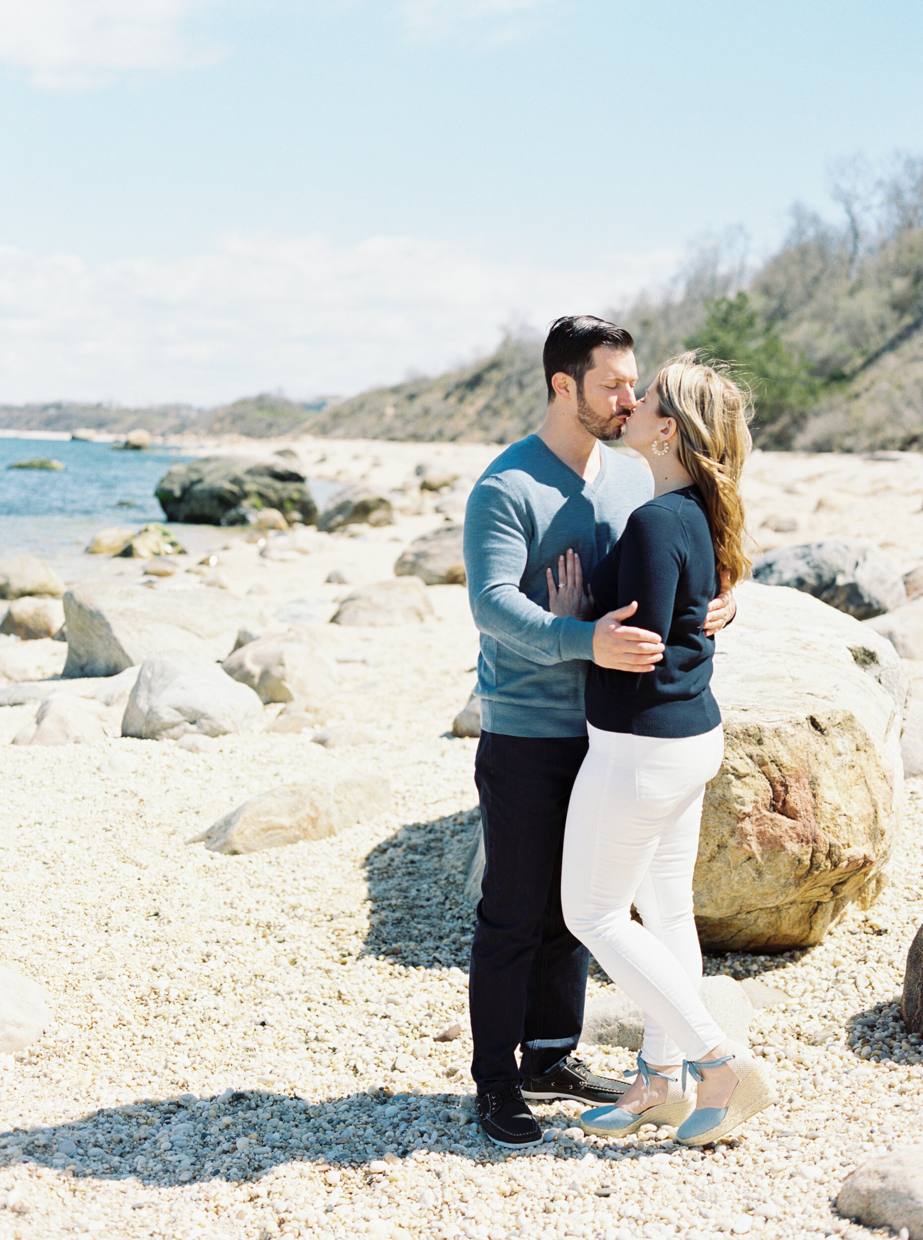 Couple kisses on beach in Greenport 