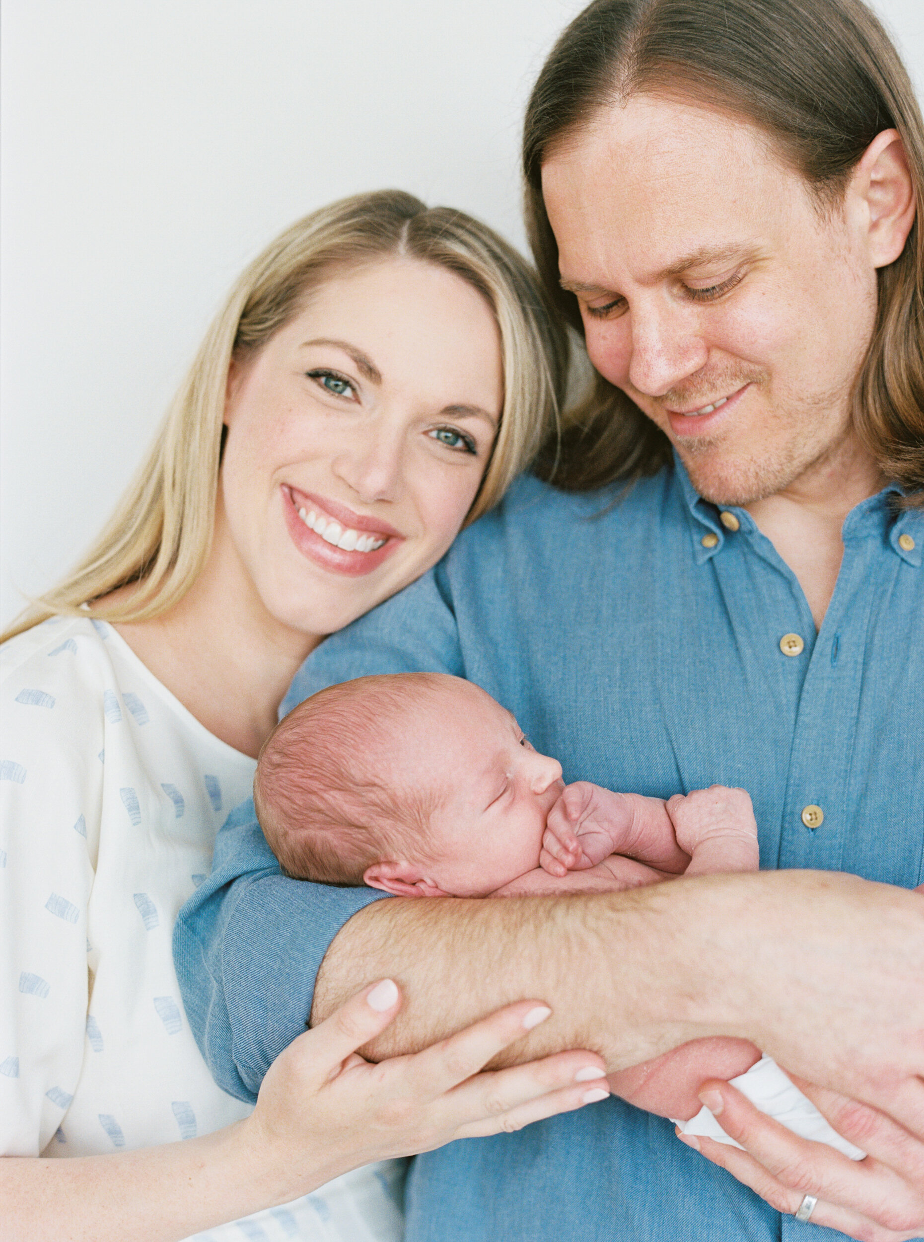 Mom and Dad hold baby Newborn Photography New York City 