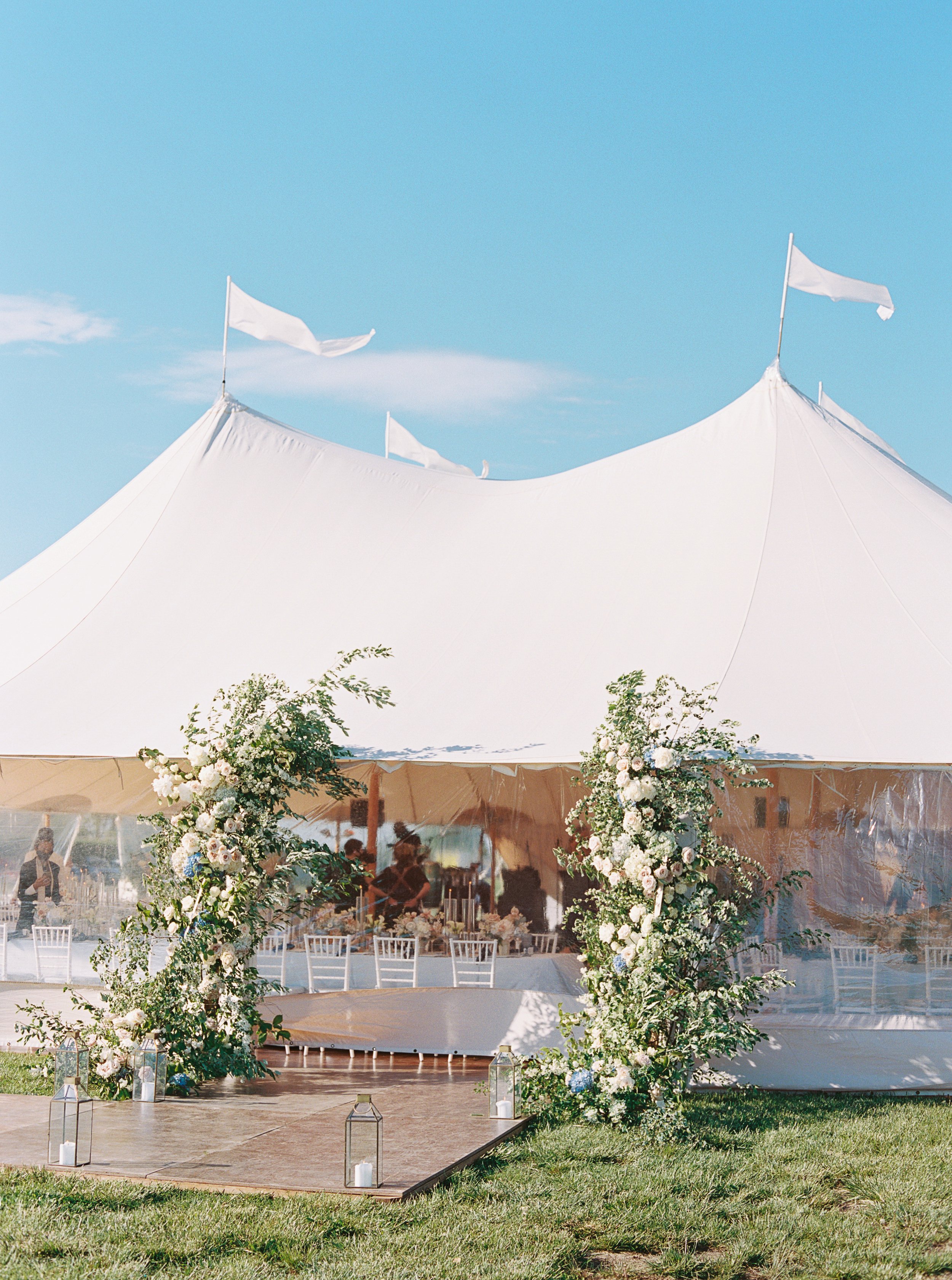 Floral Design on White Sailcloth Sperry Tent in The Hamptons