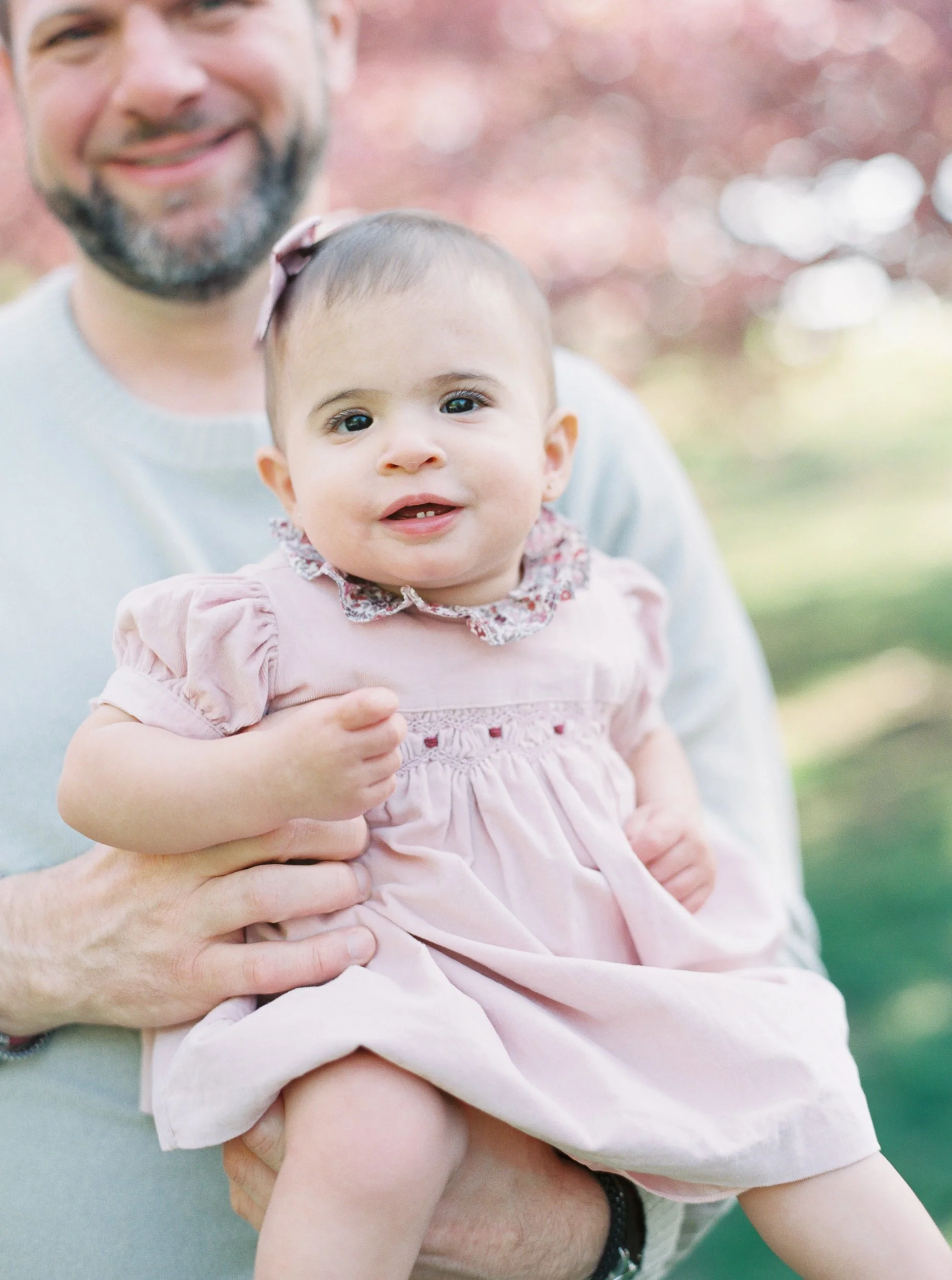 Dad Holding Baby Girl for Family Photos