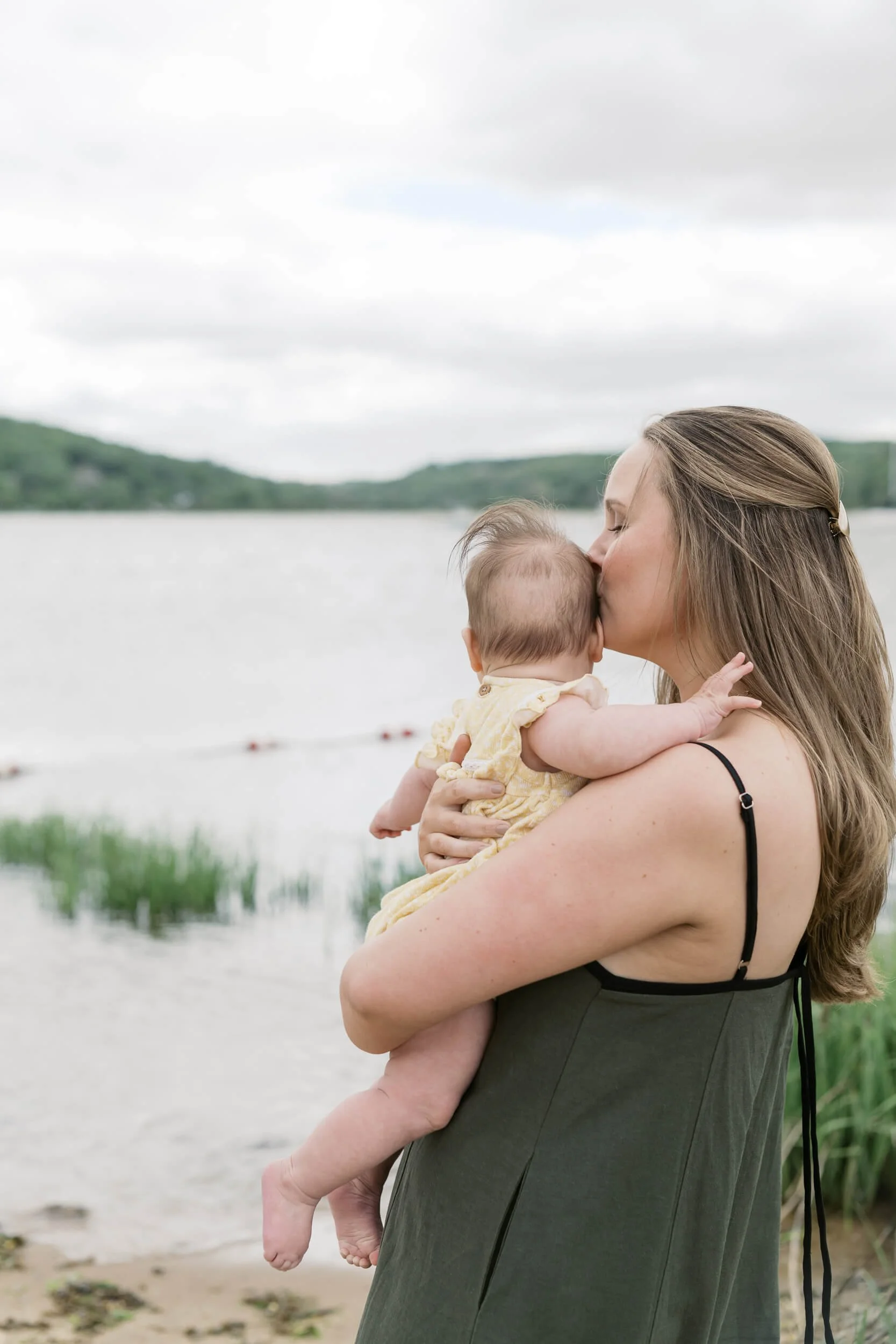 Mom Kissing Daughter on the head