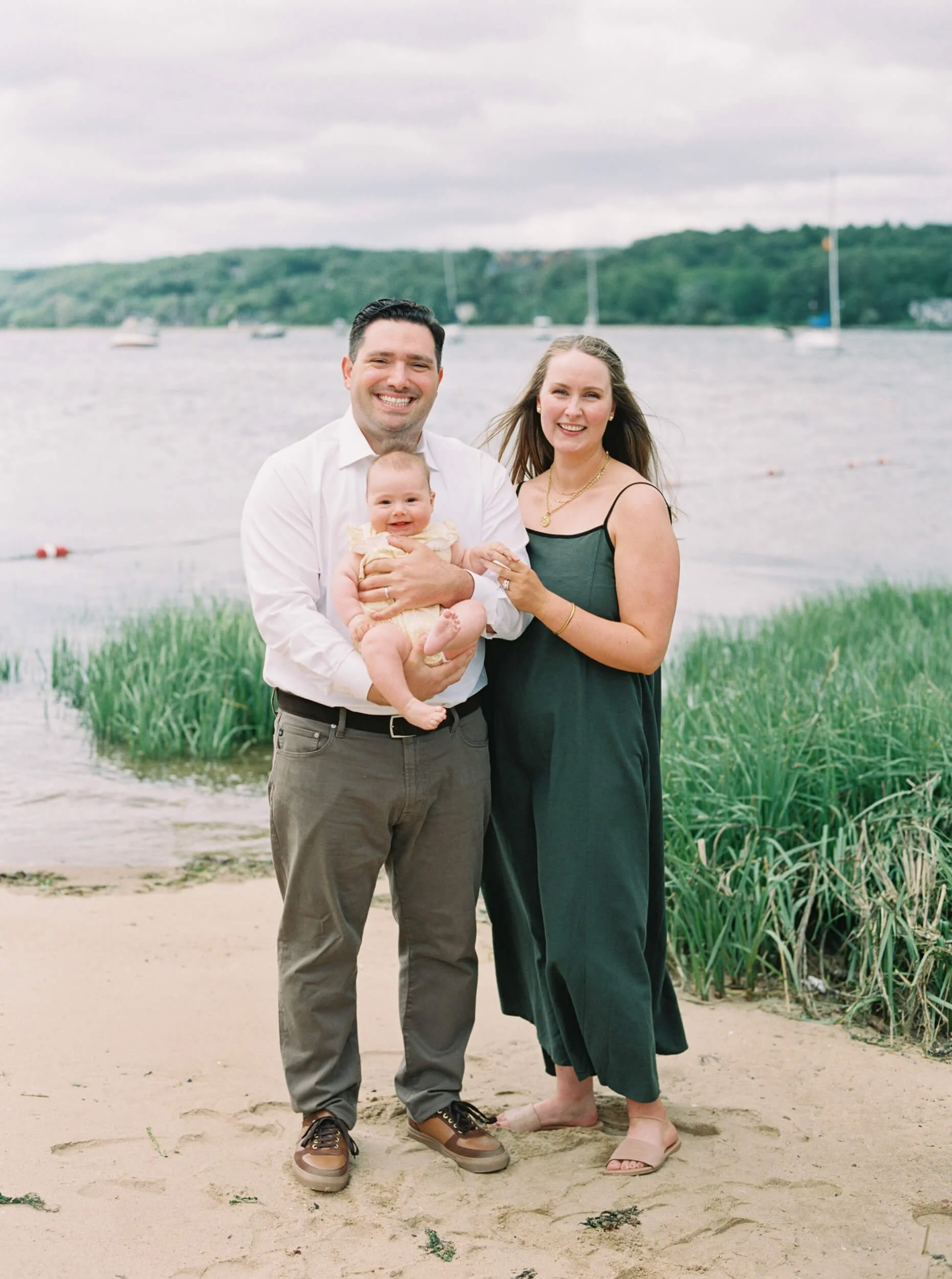 Mom and Dad with new baby girl on the beach