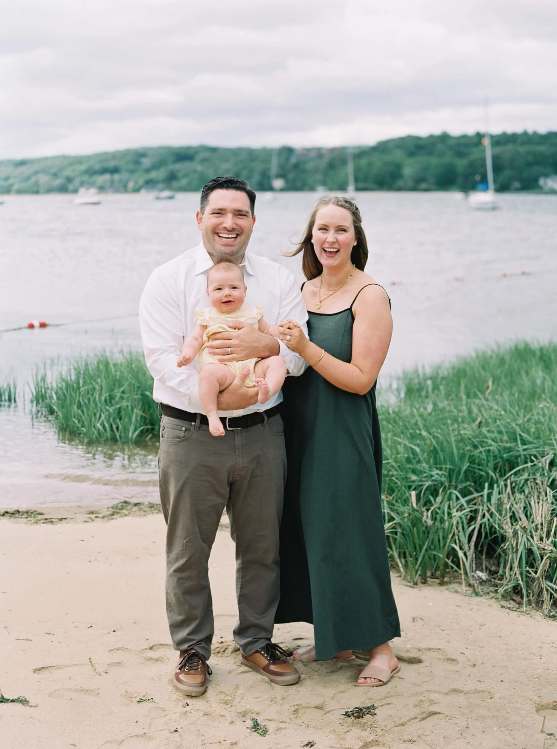 Mom and Dad holding baby girl for milestone session 