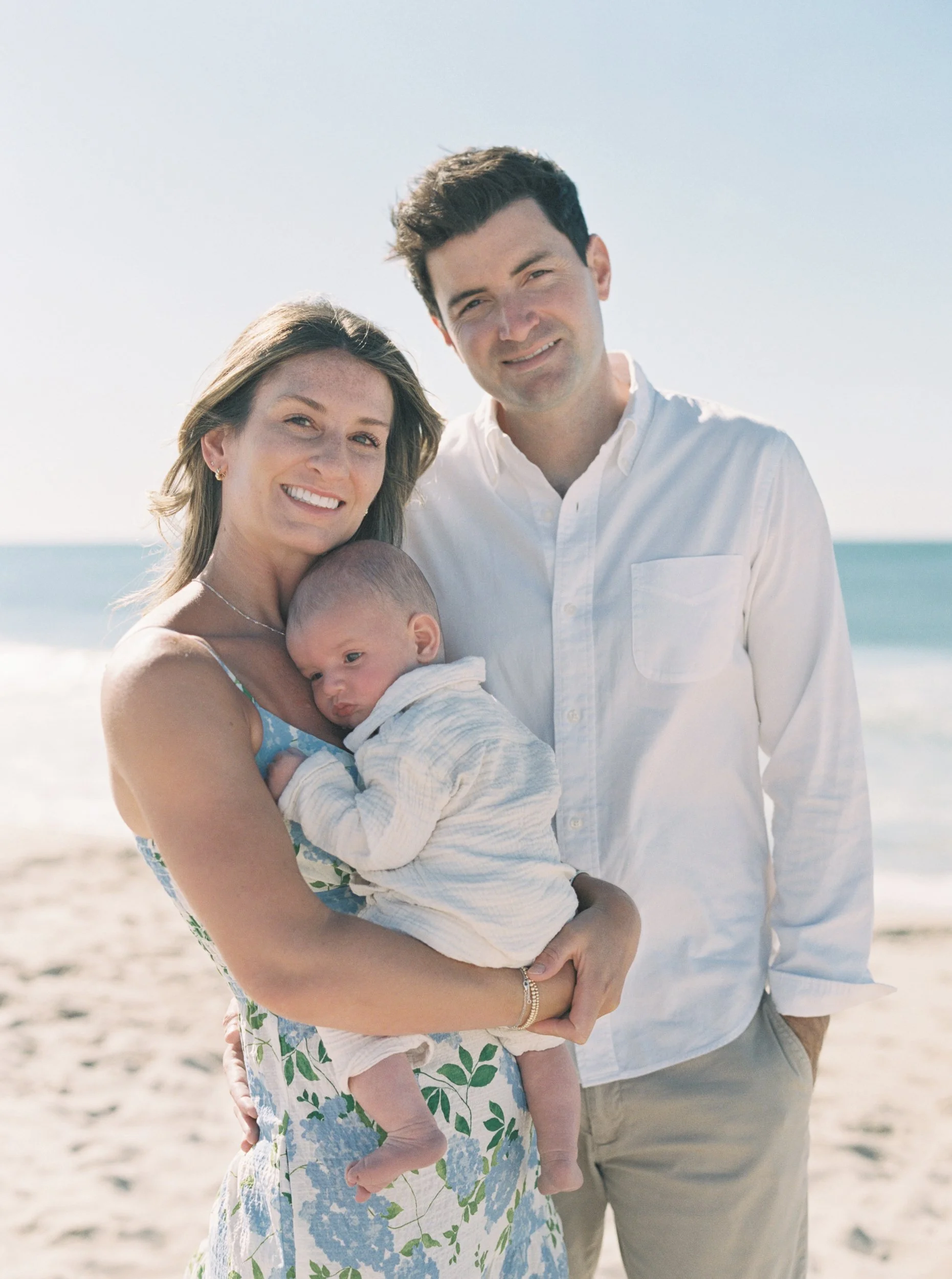 10. Hamptons family session at Main Beach with parents, baby, and their dog