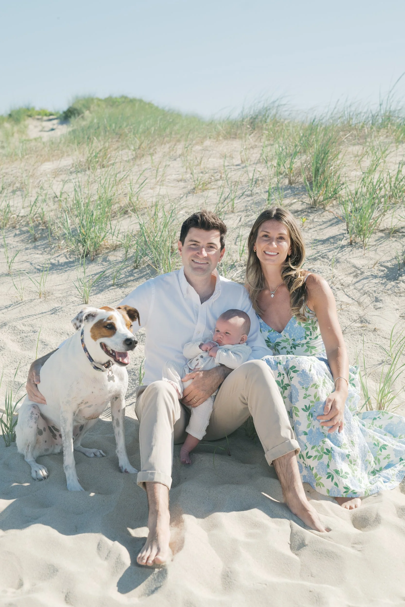 1. Mom, dad, and their baby boy at four months old at Main Beach in East Hampton