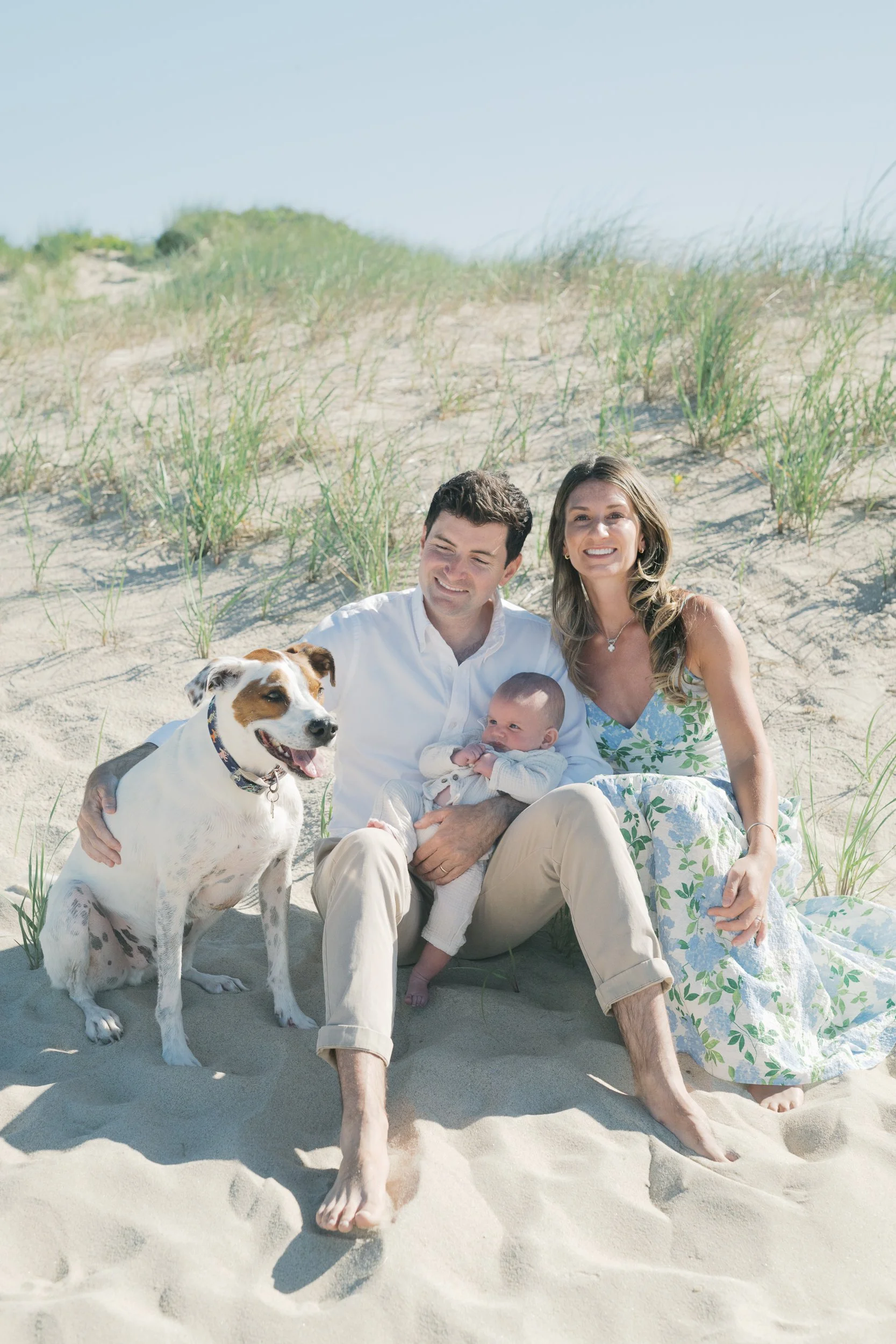 5. Baby boy and the family dog together on the beach in East Hampton, New York