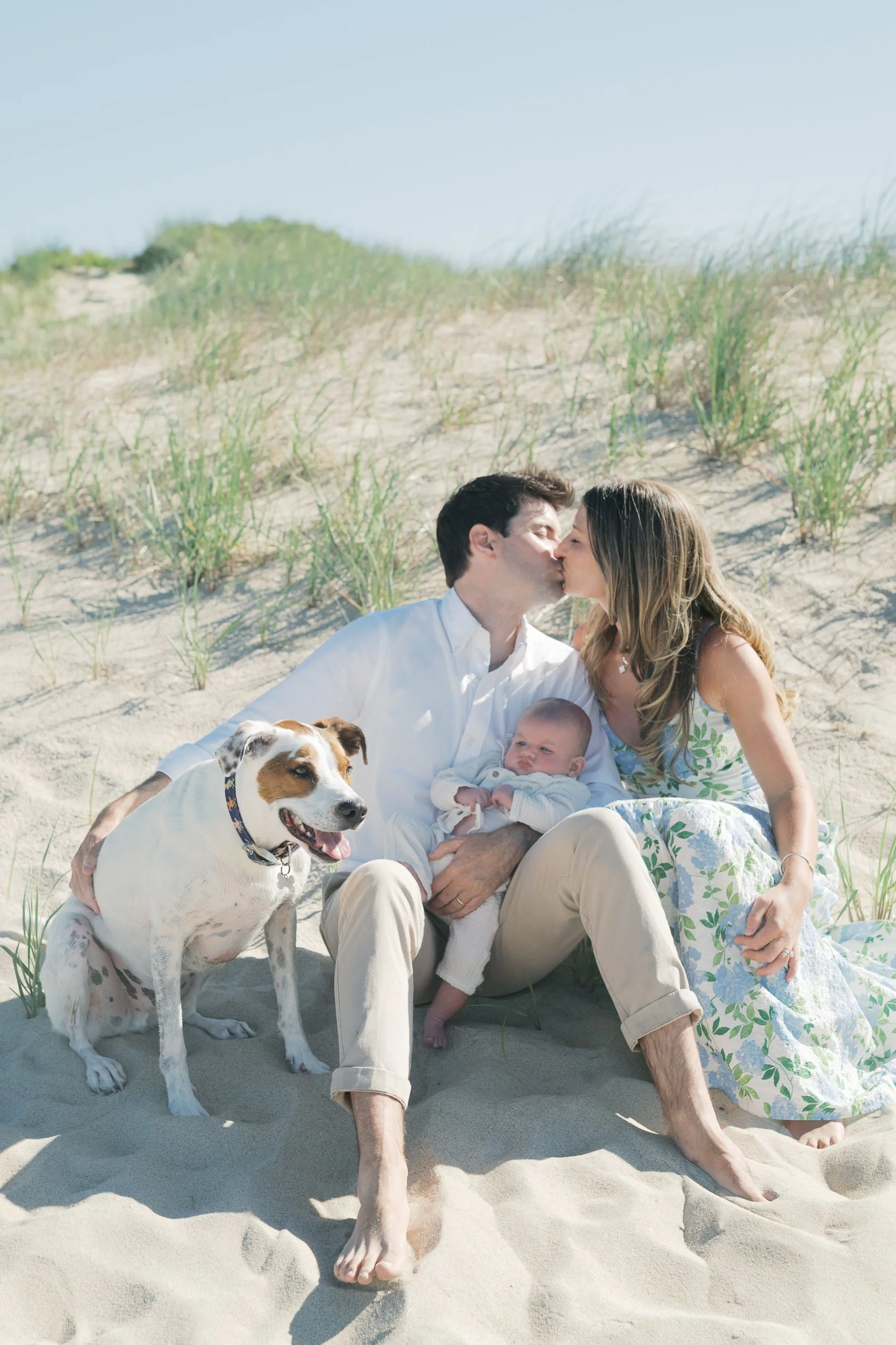 10. Hamptons family session at Main Beach with parents, baby, and their dog