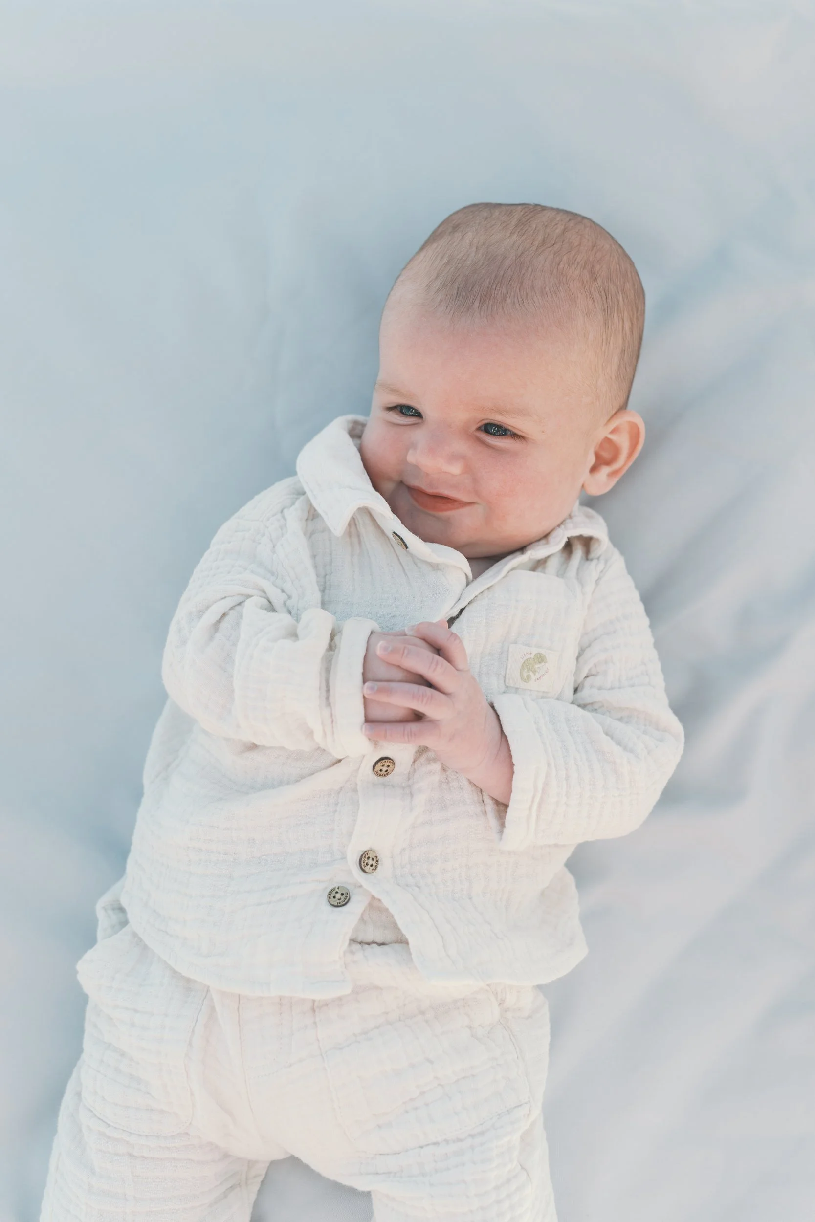 10. Hamptons family session at Main Beach with parents, baby, and their dog
