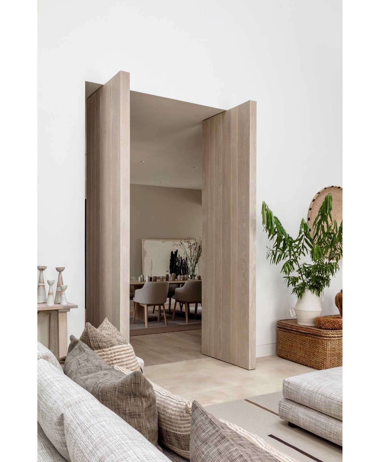We added tall timber pivot doors which when open allow this country house to have a relaxed open plan feeling and when closed create more private intimate spaces.  The spaces are linked with a calm chalky palate of natural materials @louiseholtdesign
