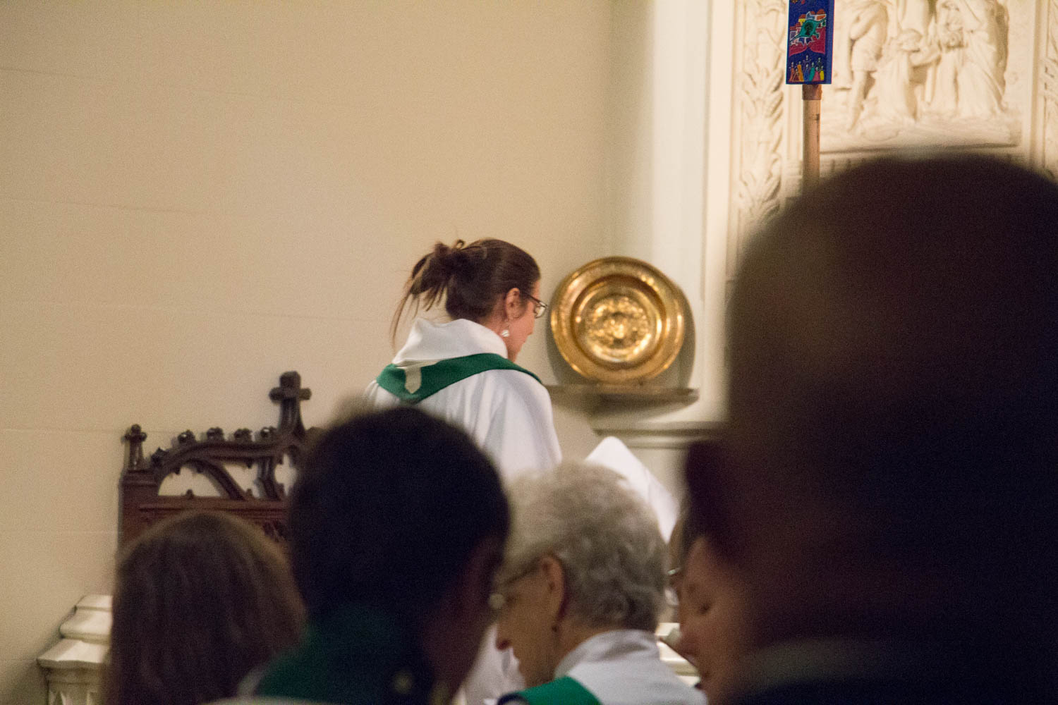 Pastor Danielle climbs the steps to the altar.