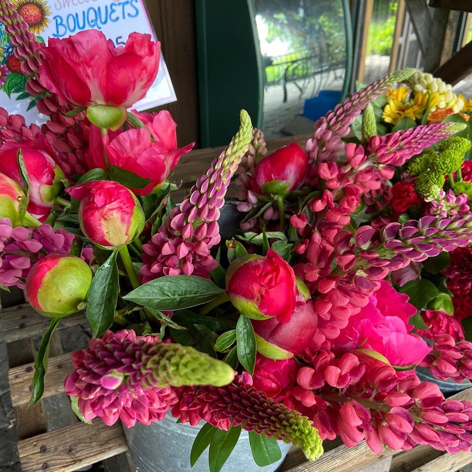 Lots of new bouquets today! Paul and Barb are making bouquets with our freshly cut peonies and lupines!