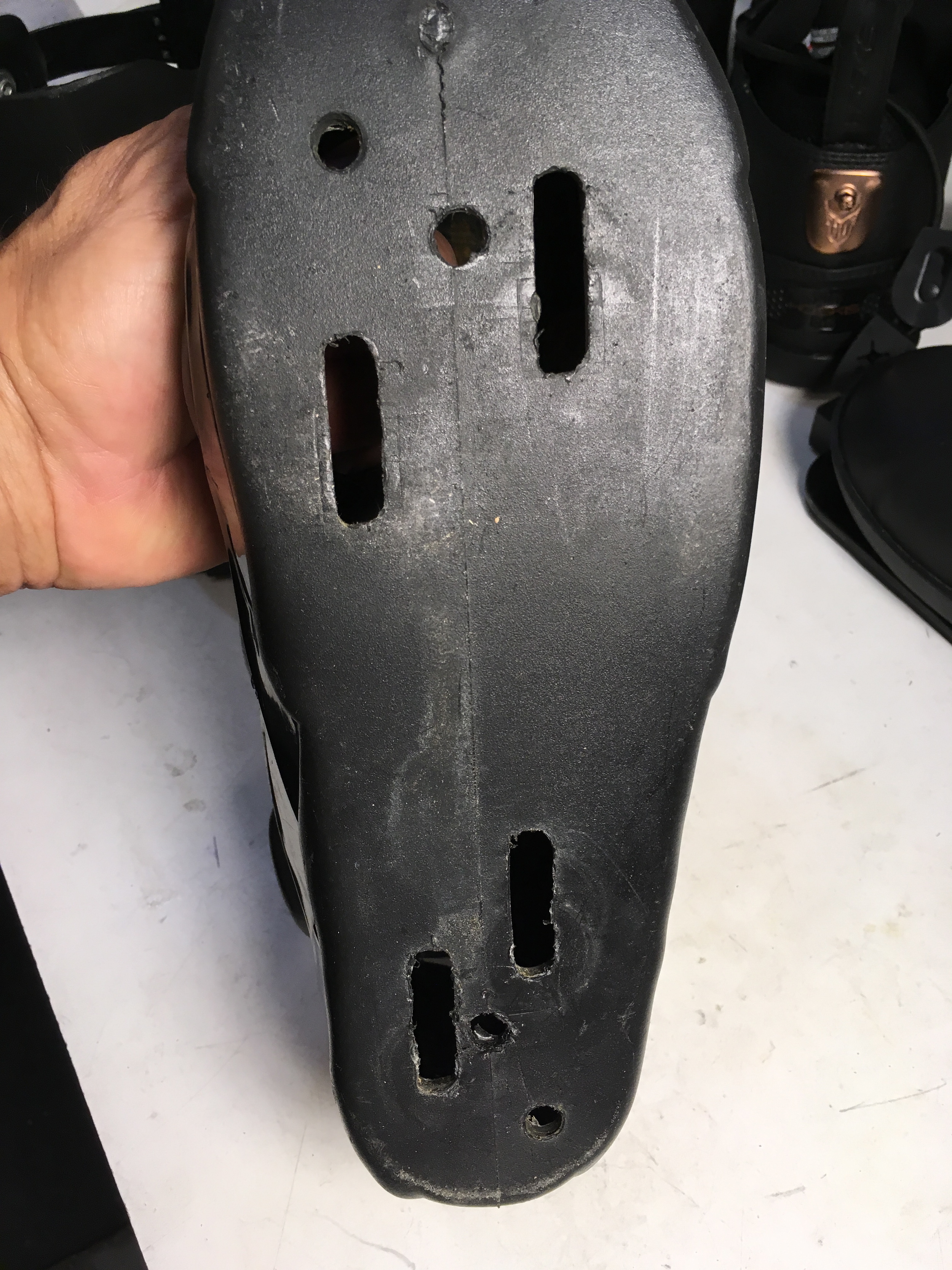 Mounting slots in bottom of boot.