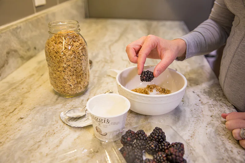 adding-berries-to-oatmeal.jpg