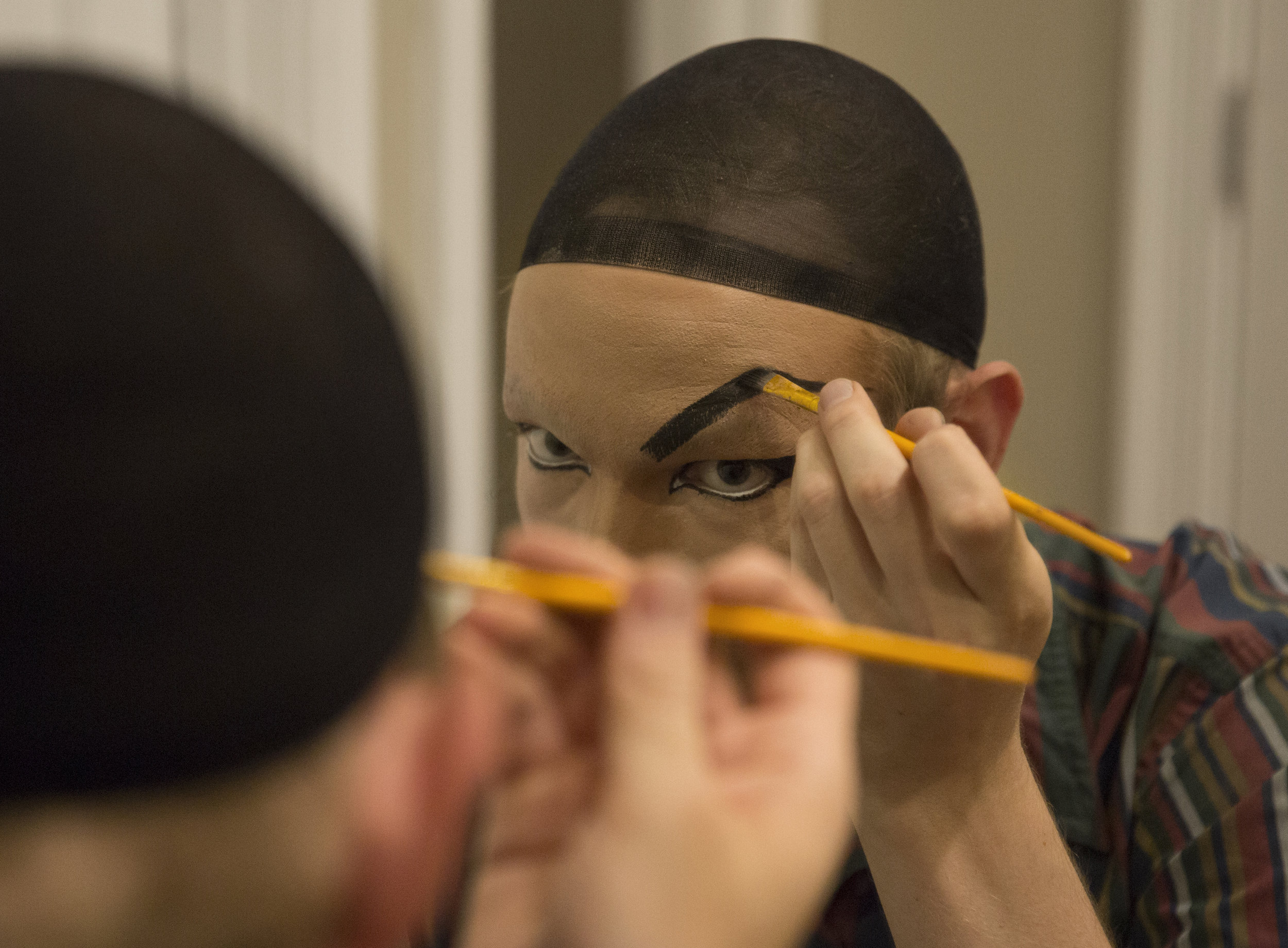 After applying five layers of Elmer’s glue to his natural eyebrows, Mount paints on more expressive eyebrows. Despite his best efforts, he decides that his eyebrows look like “cousins, not sisters.”