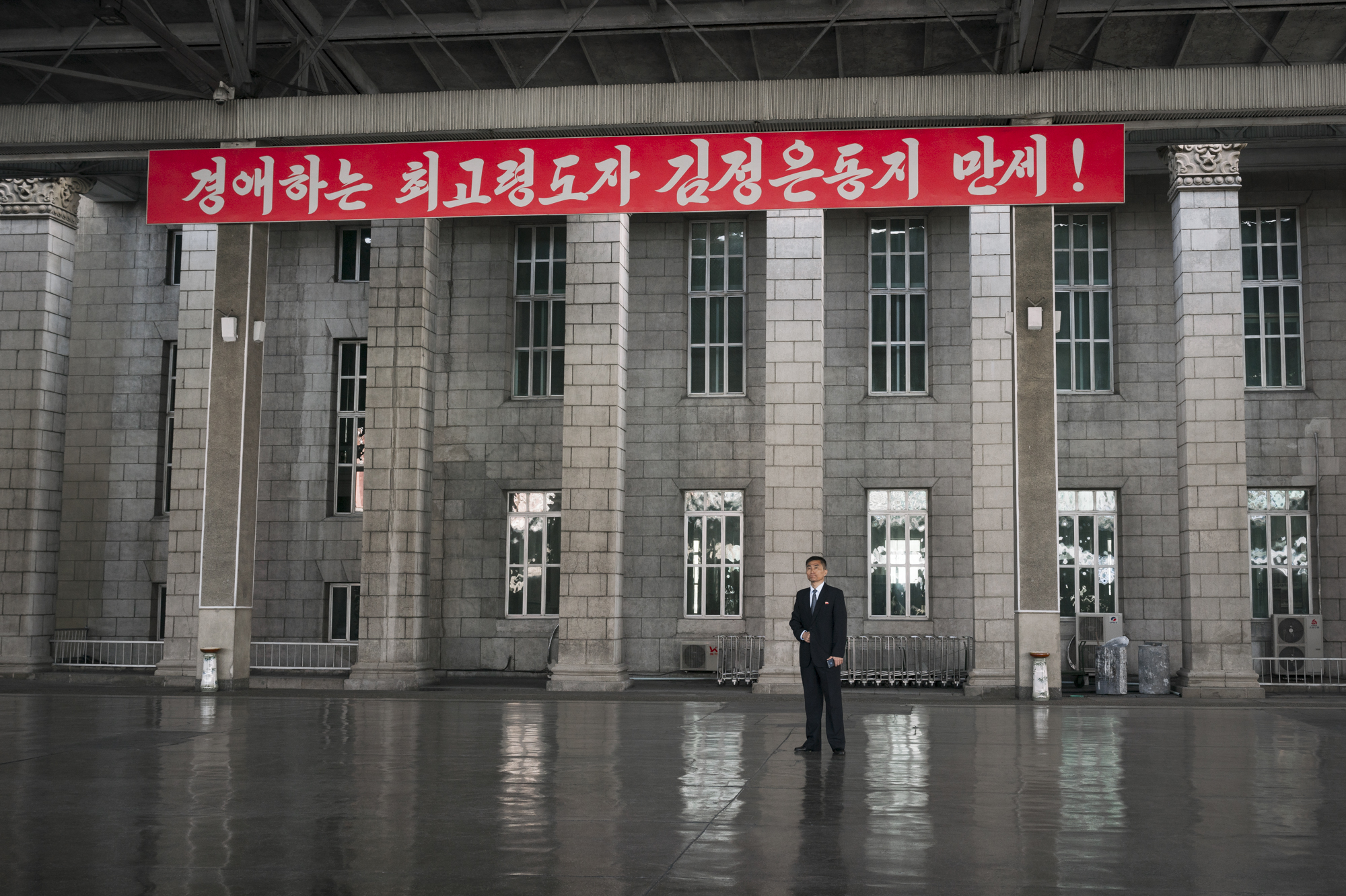  A North Korean man is standing by the platform n.1 at the Pyongyang Railway Station, which also serves as the main station in North Korea connecting most of the cities in the country. 