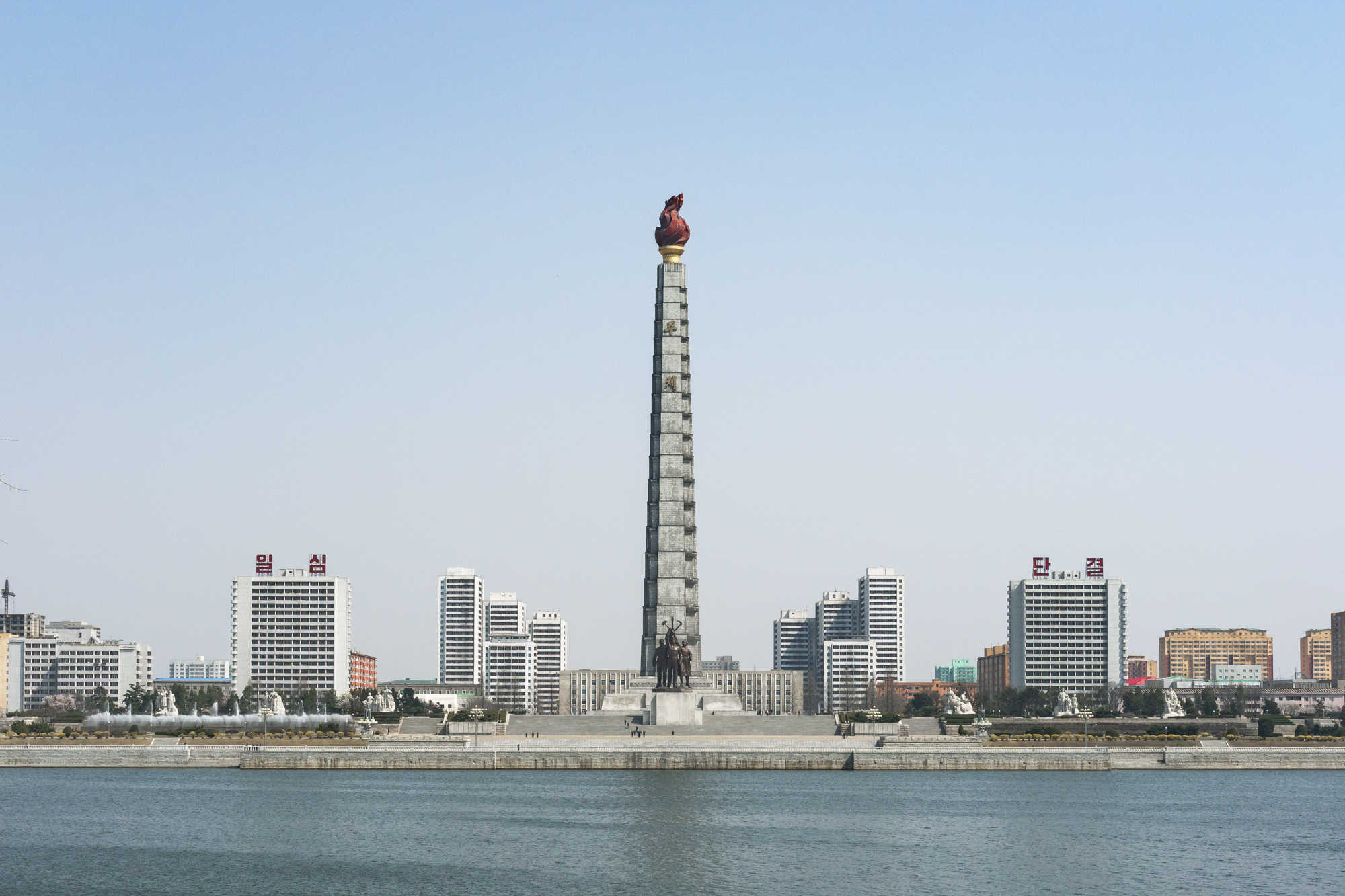 The Juche Tower, also known as the Tower of the Juche Idea , located in Pyongyang on the Taedong river, represents the North Korean Juche ideology of independence promoted by North Korean founder Kim Il Sung, which could be defined as the ability