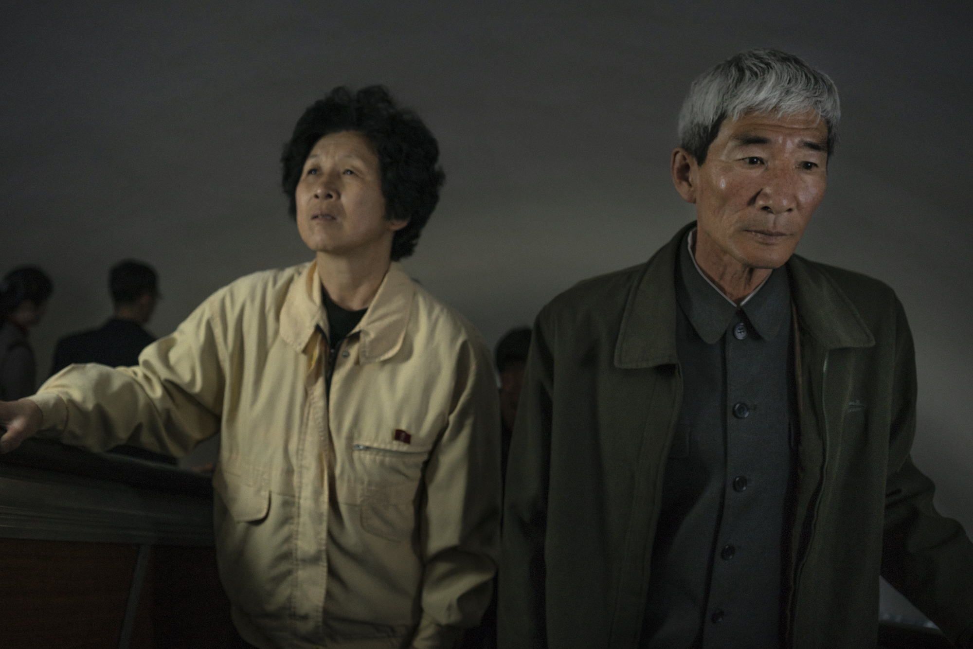 A North Korean couple rides the escalator in silence at the Pyongyang subway station.