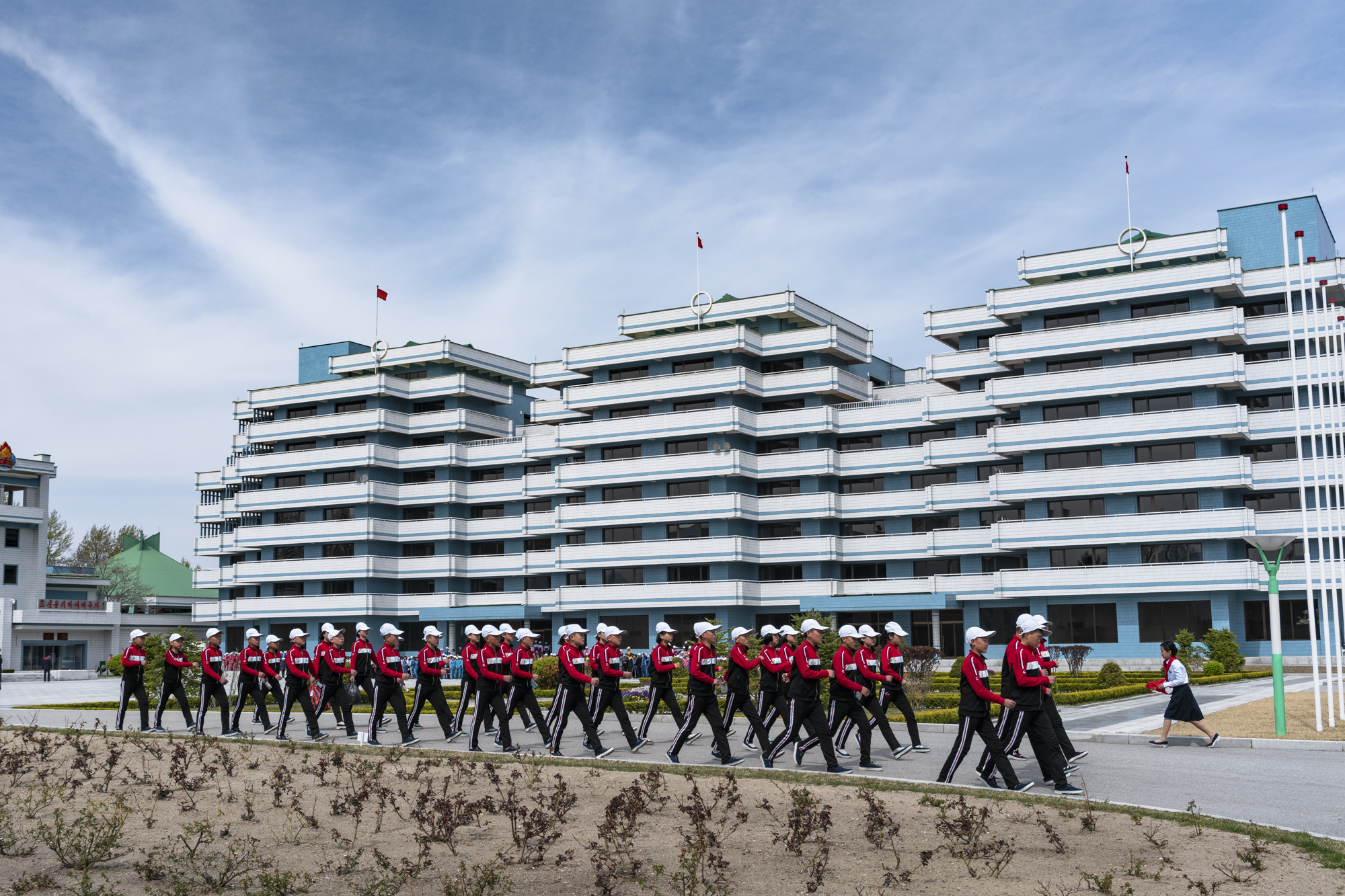  North Korean students marching in the front yard of the Songdowon International Children’s Camp, located in the Kangwŏn Province outside of Wŏnsan city.  The camp’s experience allows children to make connections worldwide, as well as helping open No