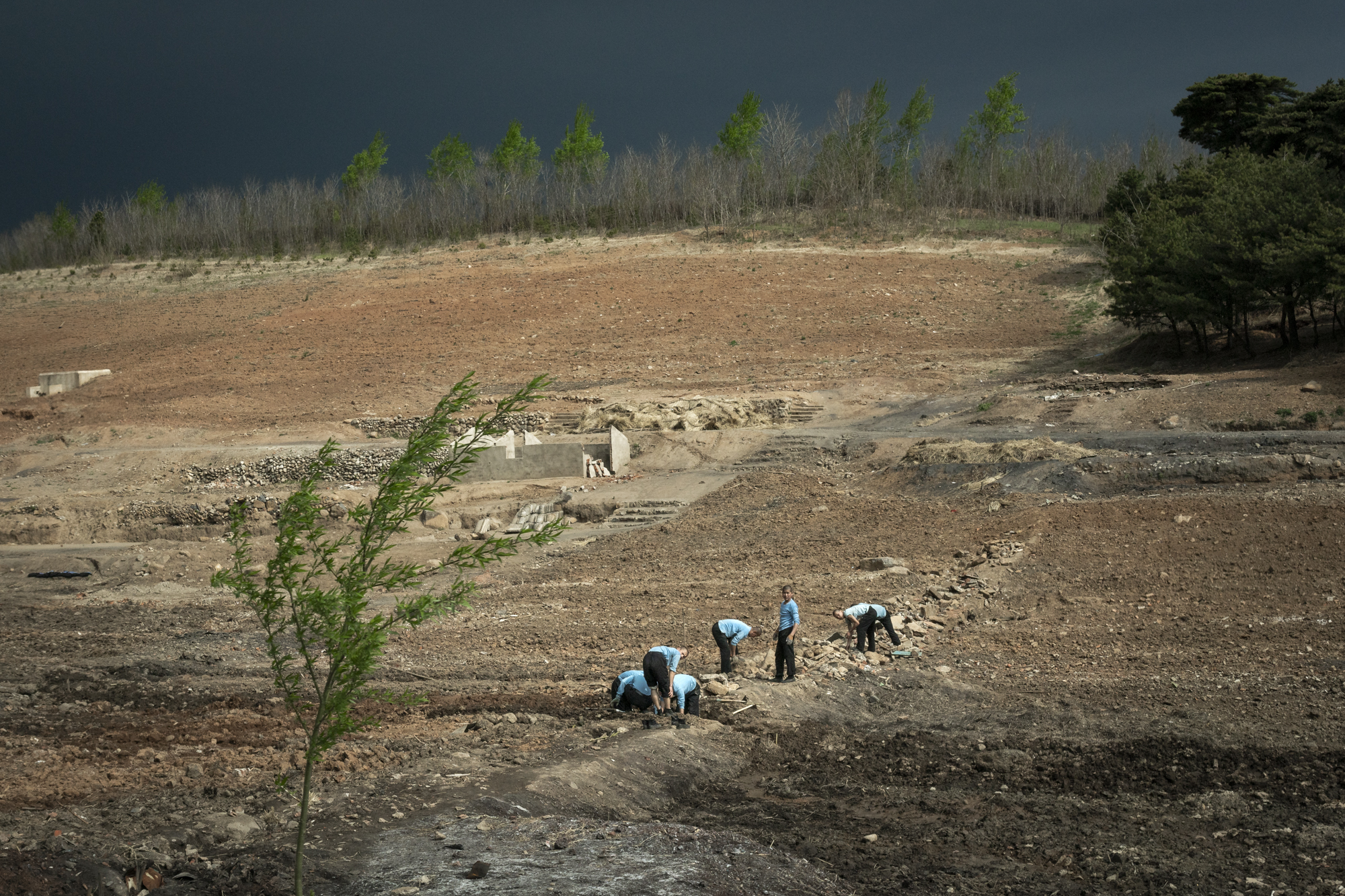  In North Korea soldiers are used as a labour force to compensate for the weak economy of the country. It is not unusual to see them working in the fields helping farmers, fixing roads, or on construction sites.  