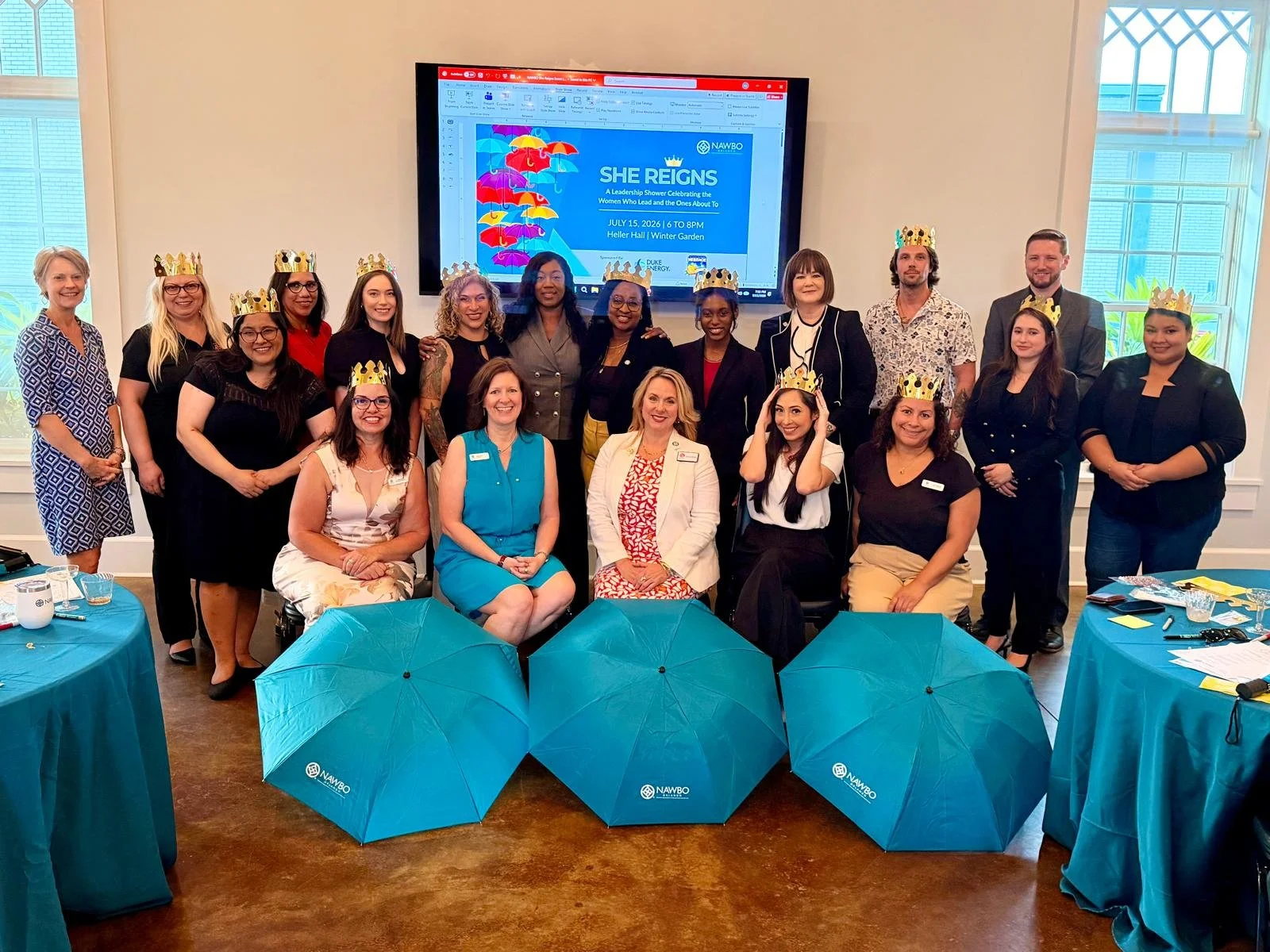 group of business men and women at the She Reigns event