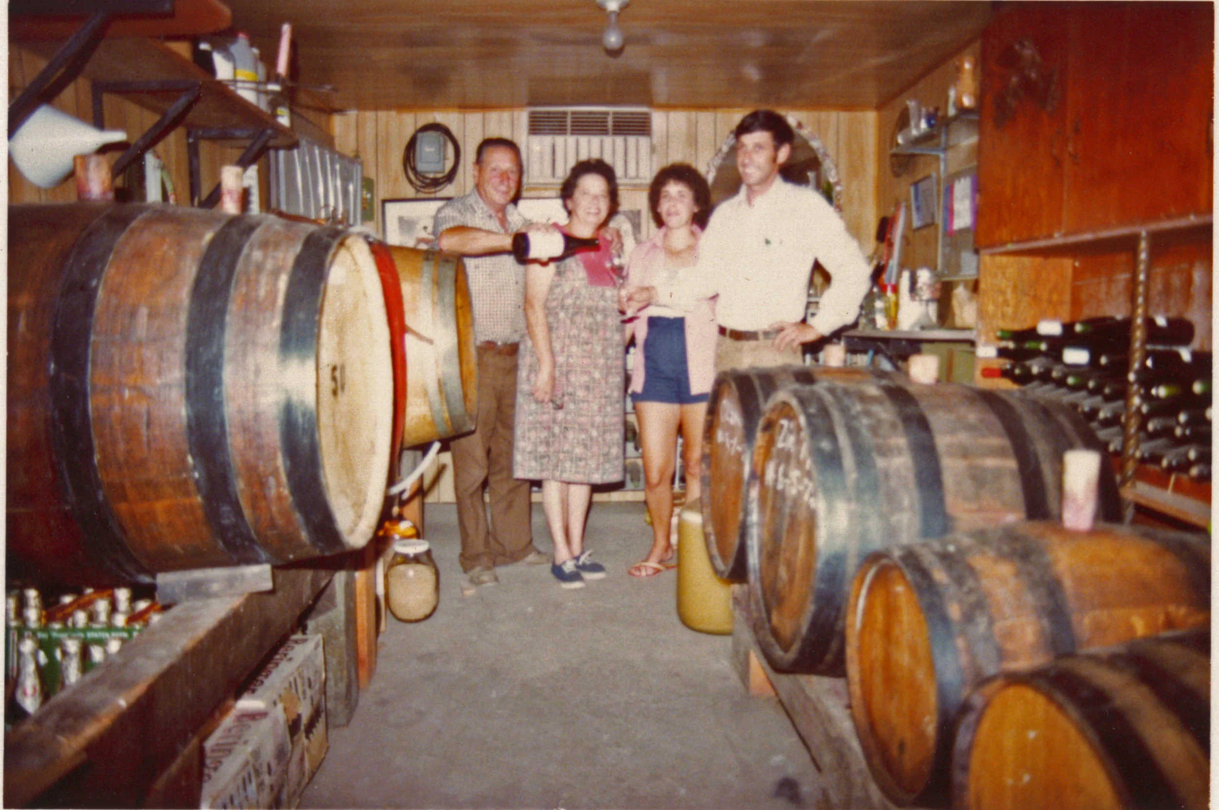Eugene, Anna, Frances, and Emil Tedeschi in their family cellar.