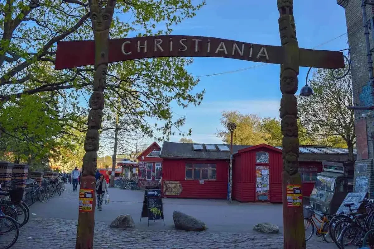 Out the front of colourful Christiania in Copenhagen