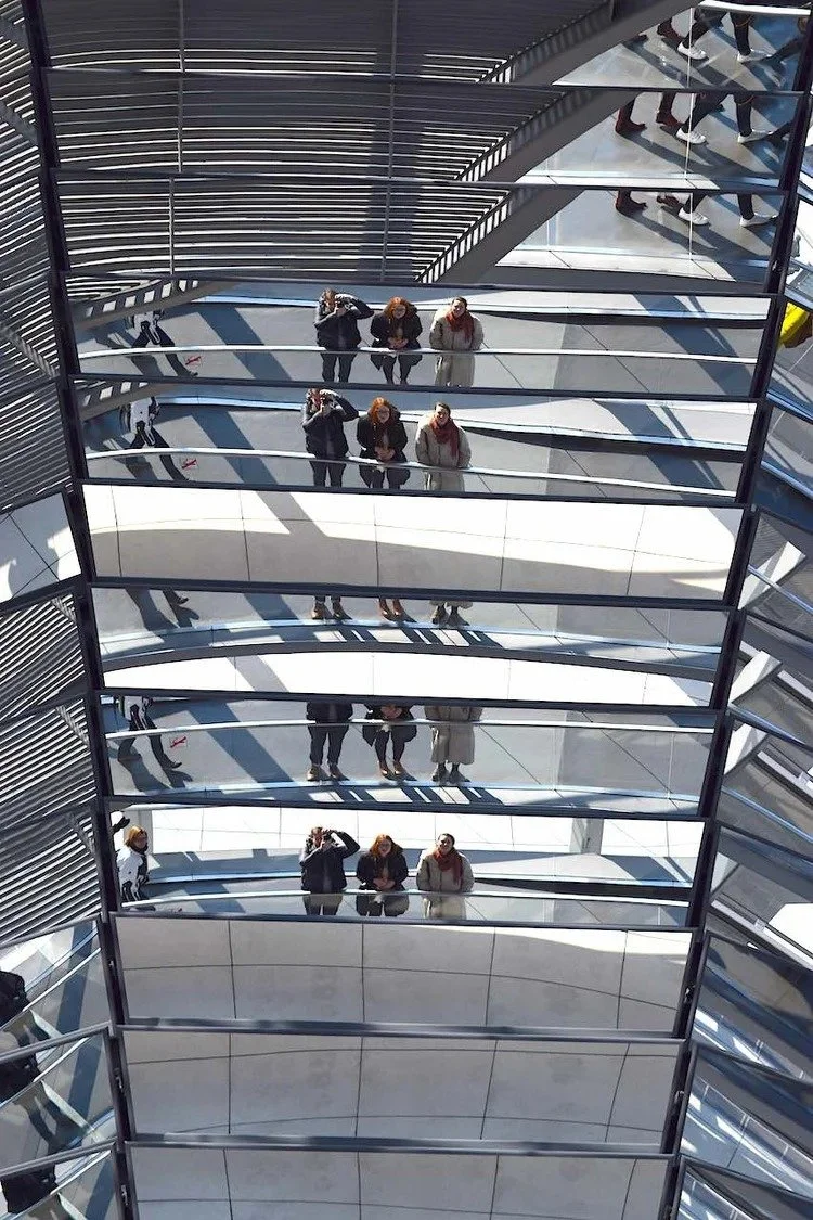 Reflection of Amber and friends in the mirrored core of the Reichstag dome