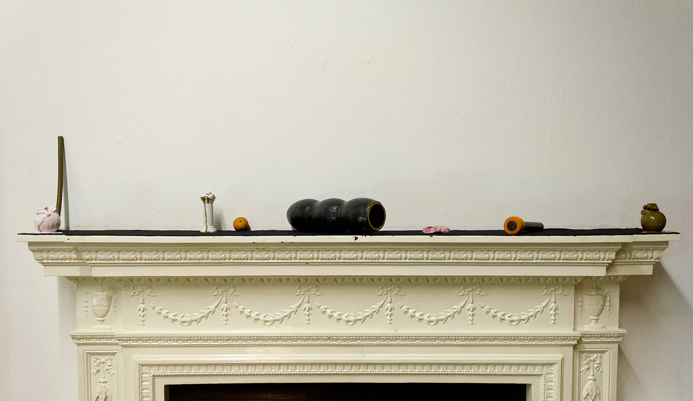 astra, (2013) ceramic, polyester resin, felt, mahogany, foam, orange, acrylic paint 200cm X 15 cm X 15cm