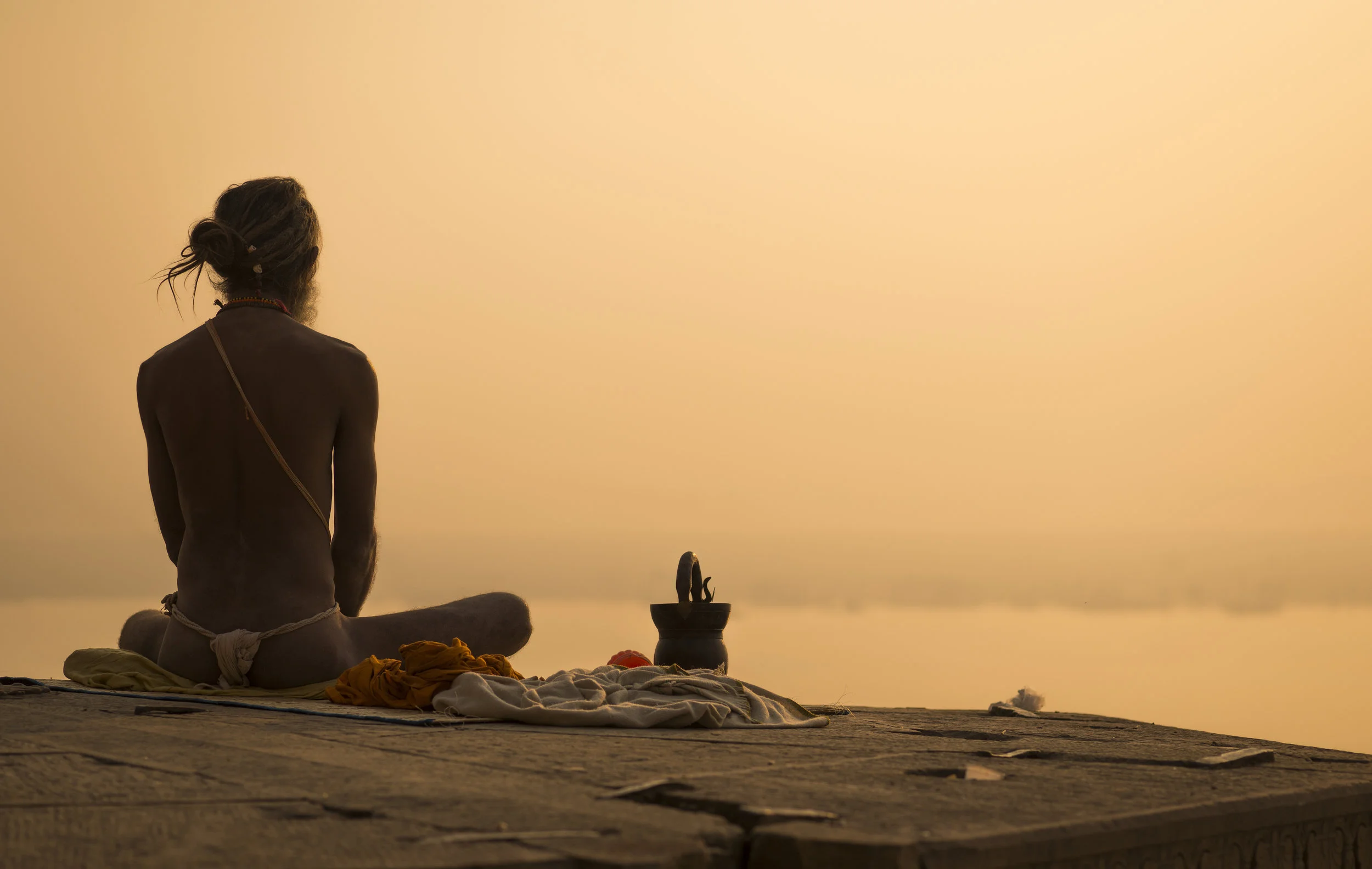 Yogi on the banks of the Ganges River in Varanasi, India