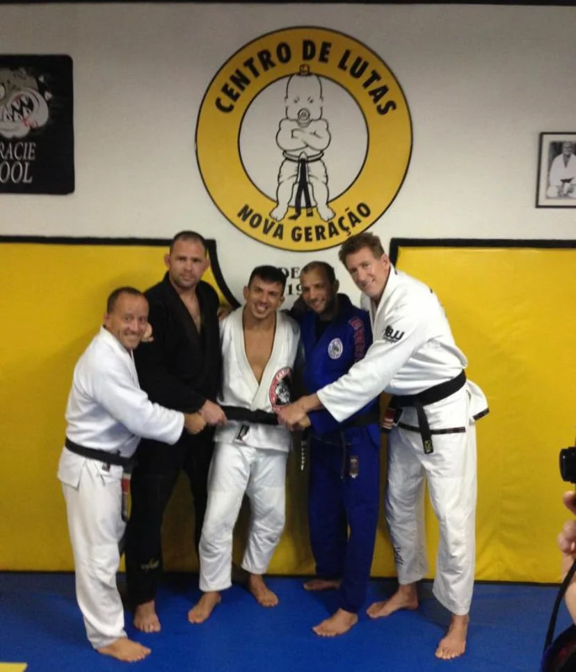 Josh Mancuso receiving his black belt at Nova Geração in Rio de Janeiro