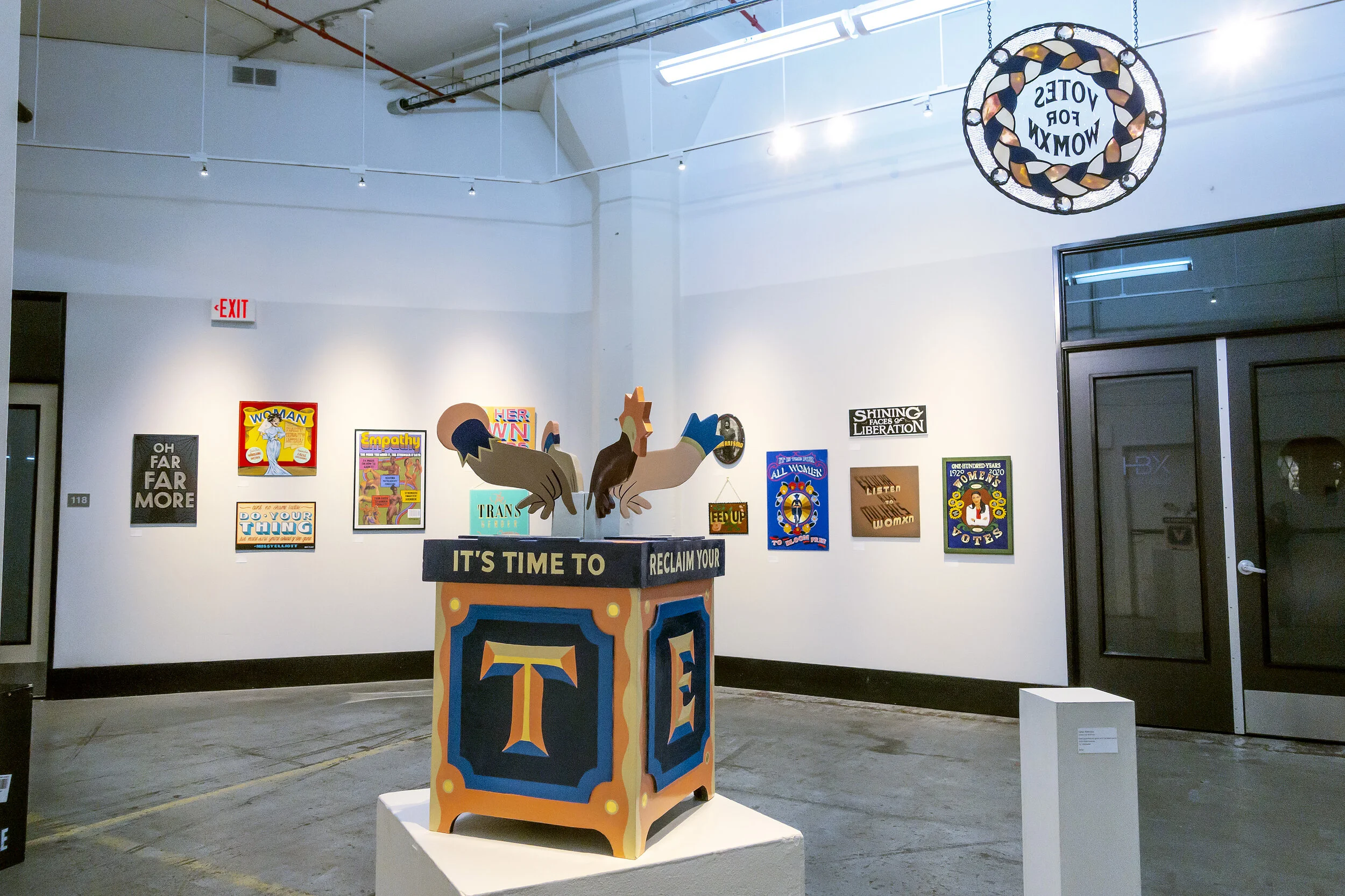 VALENTINA CASALI,  VOTE 2020   Enamel and 23k gold leaf on wood, 58 cm h x 32.5 cm l x 32.5 cm d, $1750    GINA FERRARA,  Votes for Womxn   Hand painted art glass with faceted gems and mixed metals, 16” diameter, $700