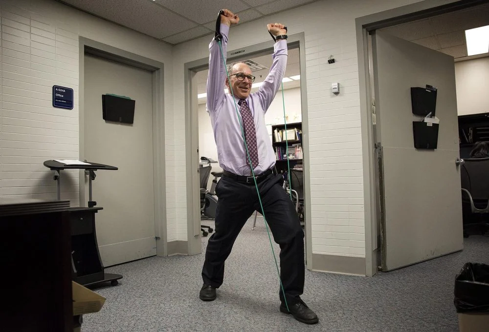(Co-host Dr Eddie Phillips exercising at work. Robin Lubbock/WBUR)