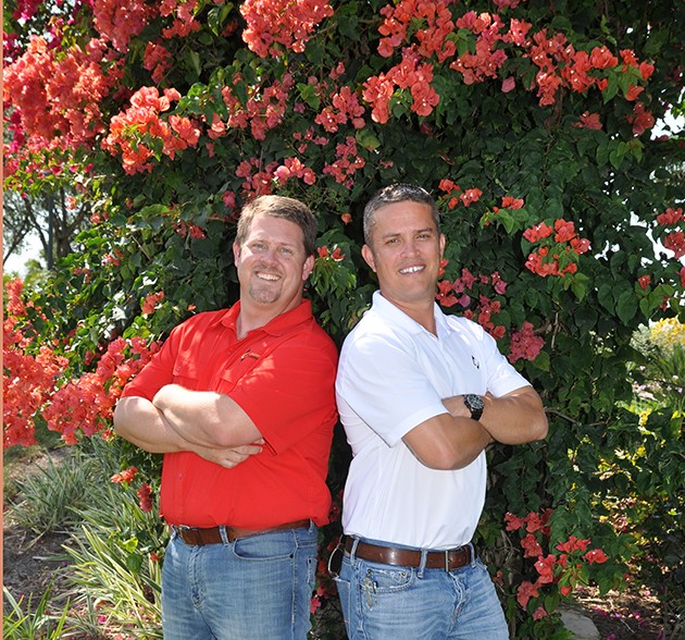 Blake Crawford, owner of Crawford Landscaping Group, and Keith Mahan, president and owner, project revenues will reach $13 million this year. Photo by Ed Clement