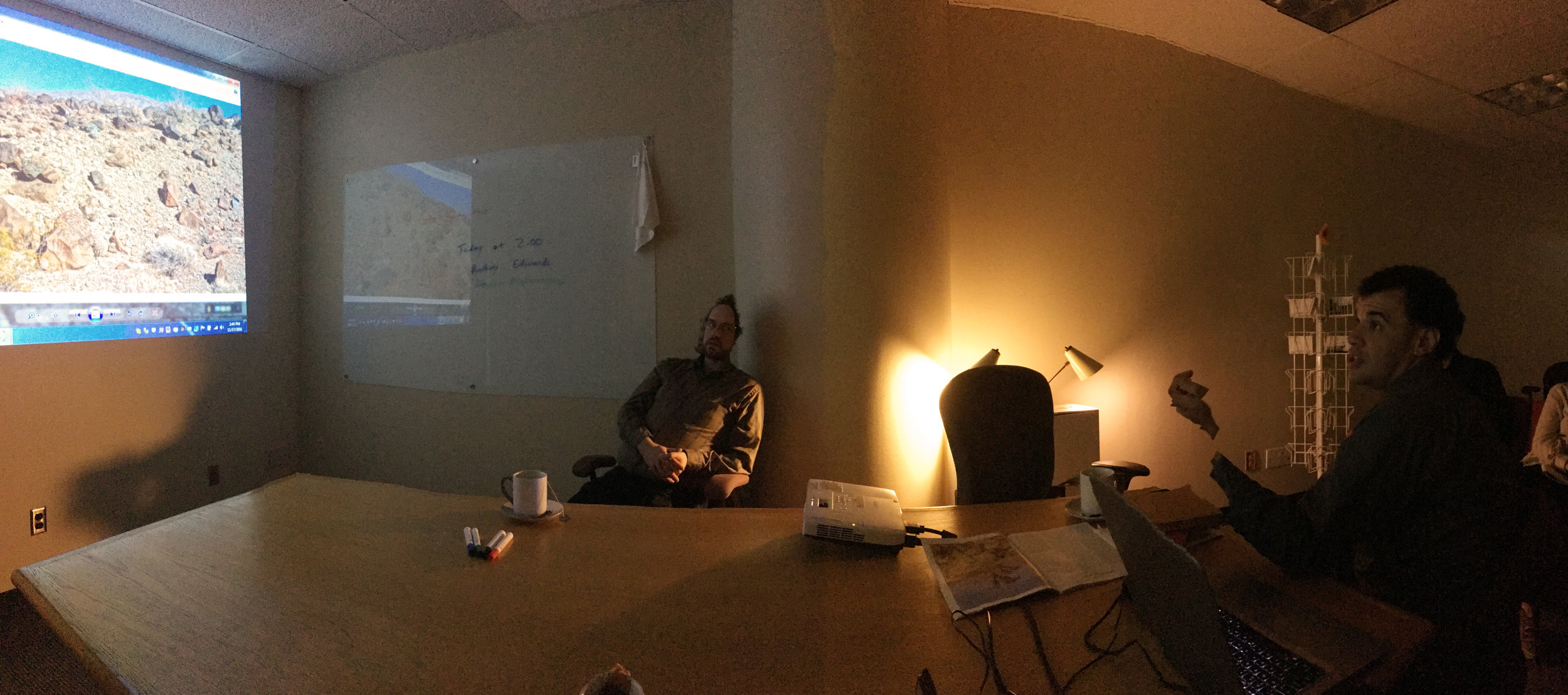 Anthony Edwards shows some of his visualizations of artifacts in the Mojave Desert to the Geo-Humanities tea hour crowd. 11/17/16.