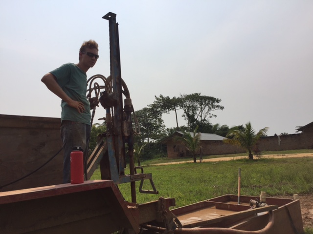 Chris at Work Drilling a New Well at Our CFM Mission