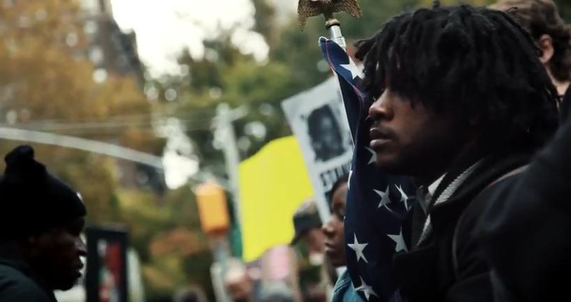 Image: Film still of people at a protest against police brutality