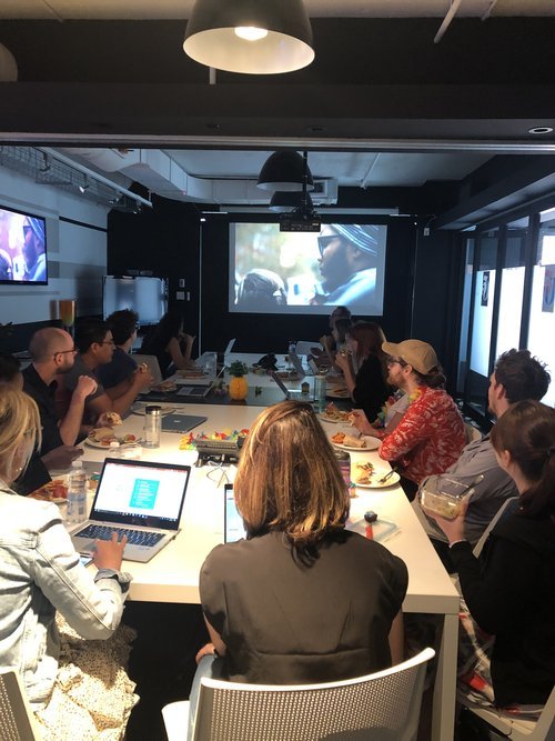 Image: Photo of employees from Edelman sitting at a table at their screening of the film