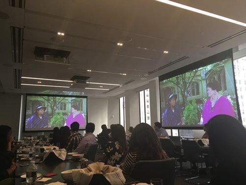 Image: Photo of employees of Weil, Gotshal, and Manges seated at a table at their film screening