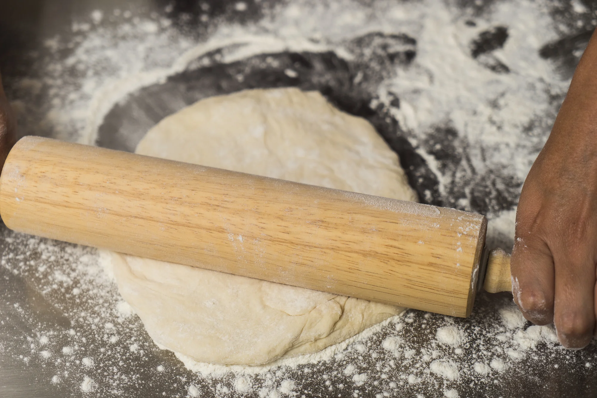 Yes that's a rolling pin on pizza dough....it will be ok!