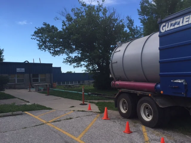 Roofers showed up today to begin vacuuming gravel from the roof in preparation for a full repair/replace. 