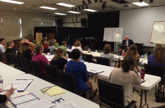 Phillip Kilgore, Director of the Barney Charter School Initiative, leads the Seven Oaks faculty in a discussion of the foundations of classical education. 