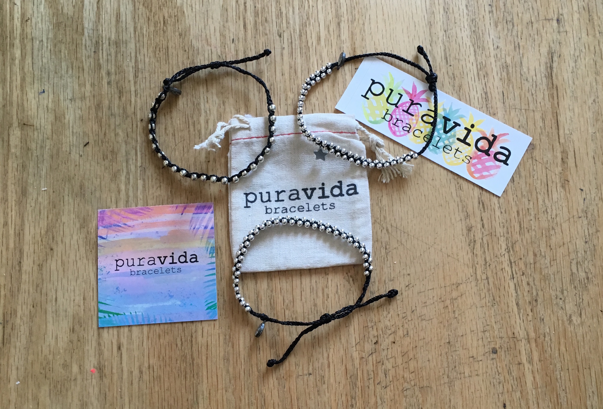 My mom bought some Pura Vida Bracelets for herself. Clockwise from left: Black Studded . Track Bead w/ Silver Bitty Star Black . Silver Track Bead Black .