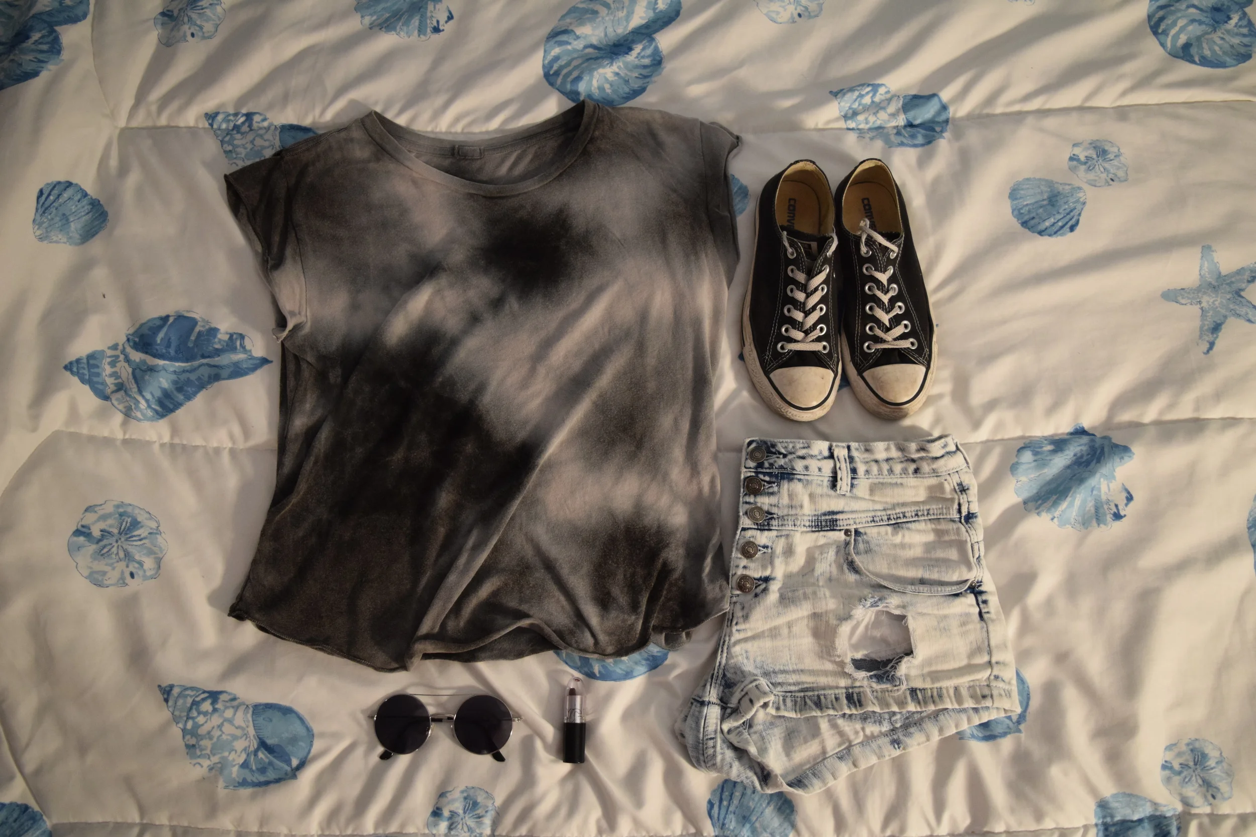 Top (from Pacsun by Brandy Melville , but I can't find the exact style online). Shorts . Sneakers . Sunglasses (similar). Lipstick.