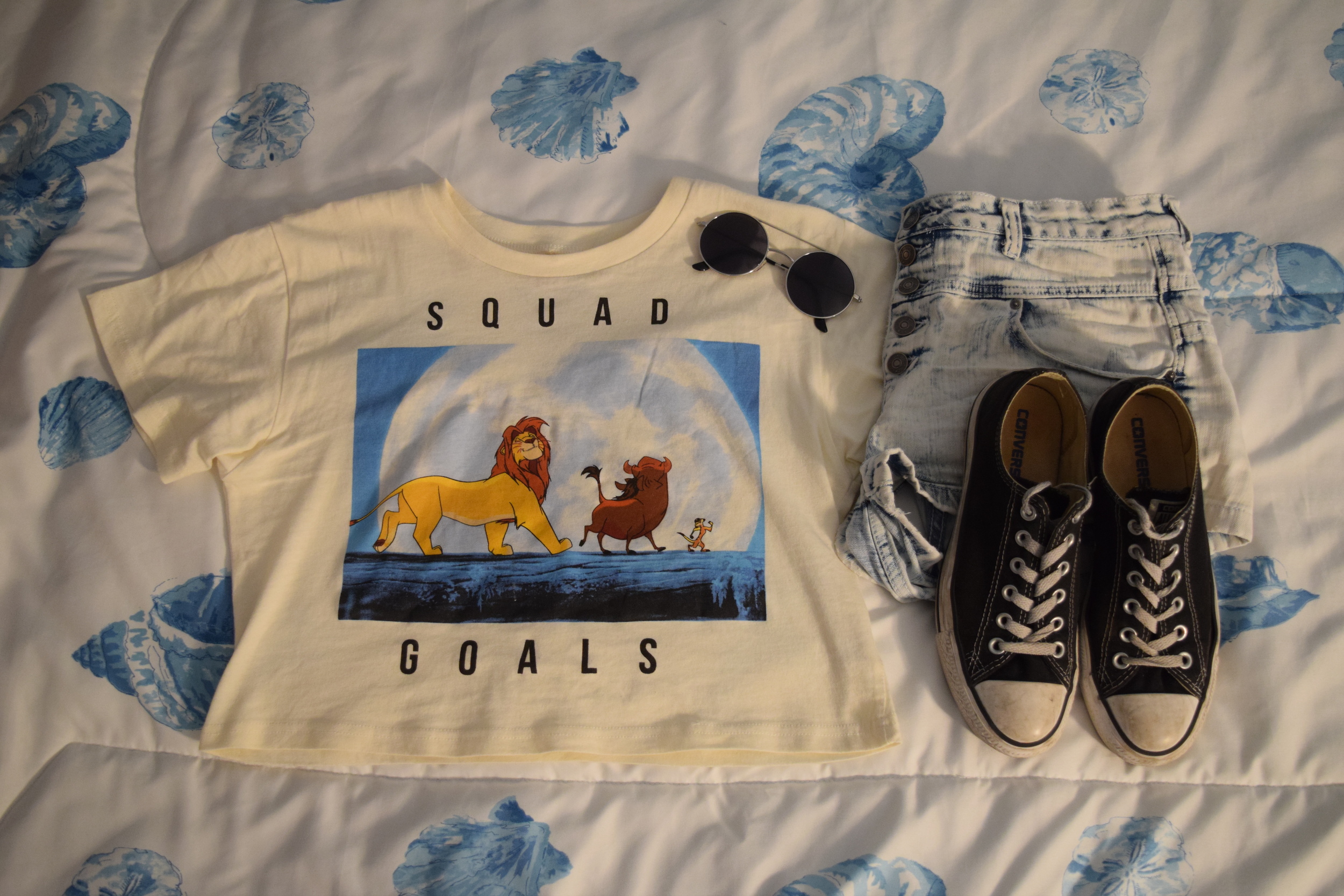 Shirt . Shorts . Shoes . Sunglasses (similar).