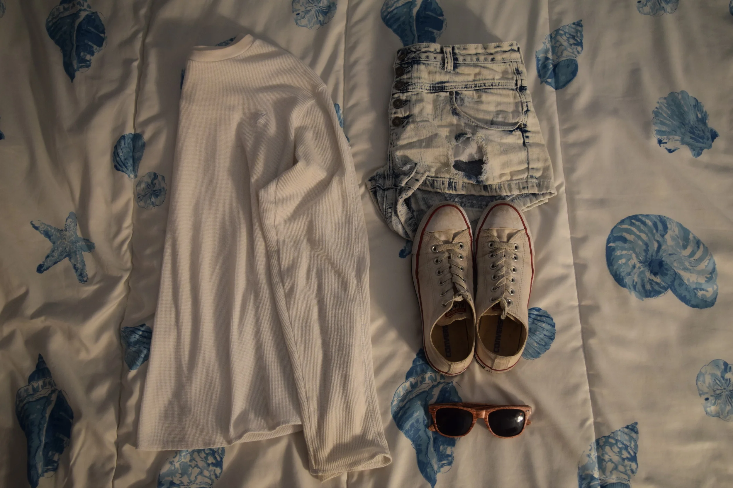Shirt (I have no clue I'm sorry). Shorts . Sneakers . Sunglasses (mine are lighter). 