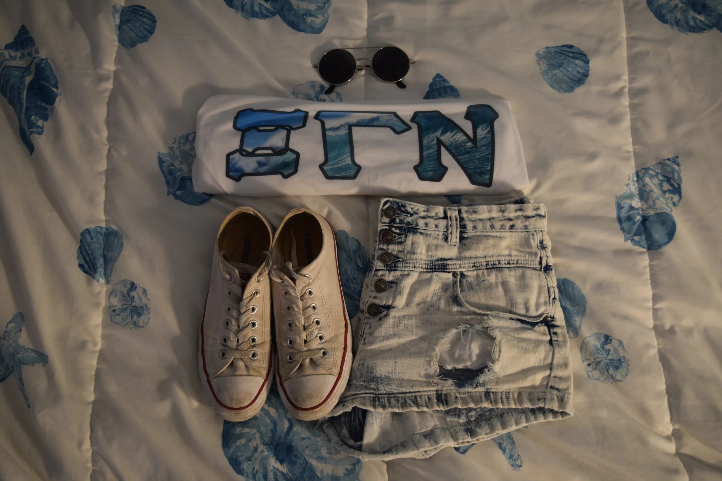 Tank Top. Shorts. Sneakers. Sunglasses (similar).