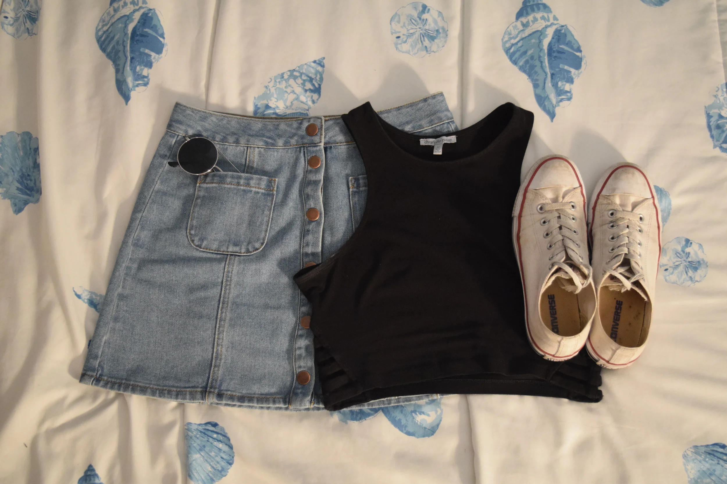 Top (similar). Skirt (different color). Sneakers . Sunglasses (similar). 